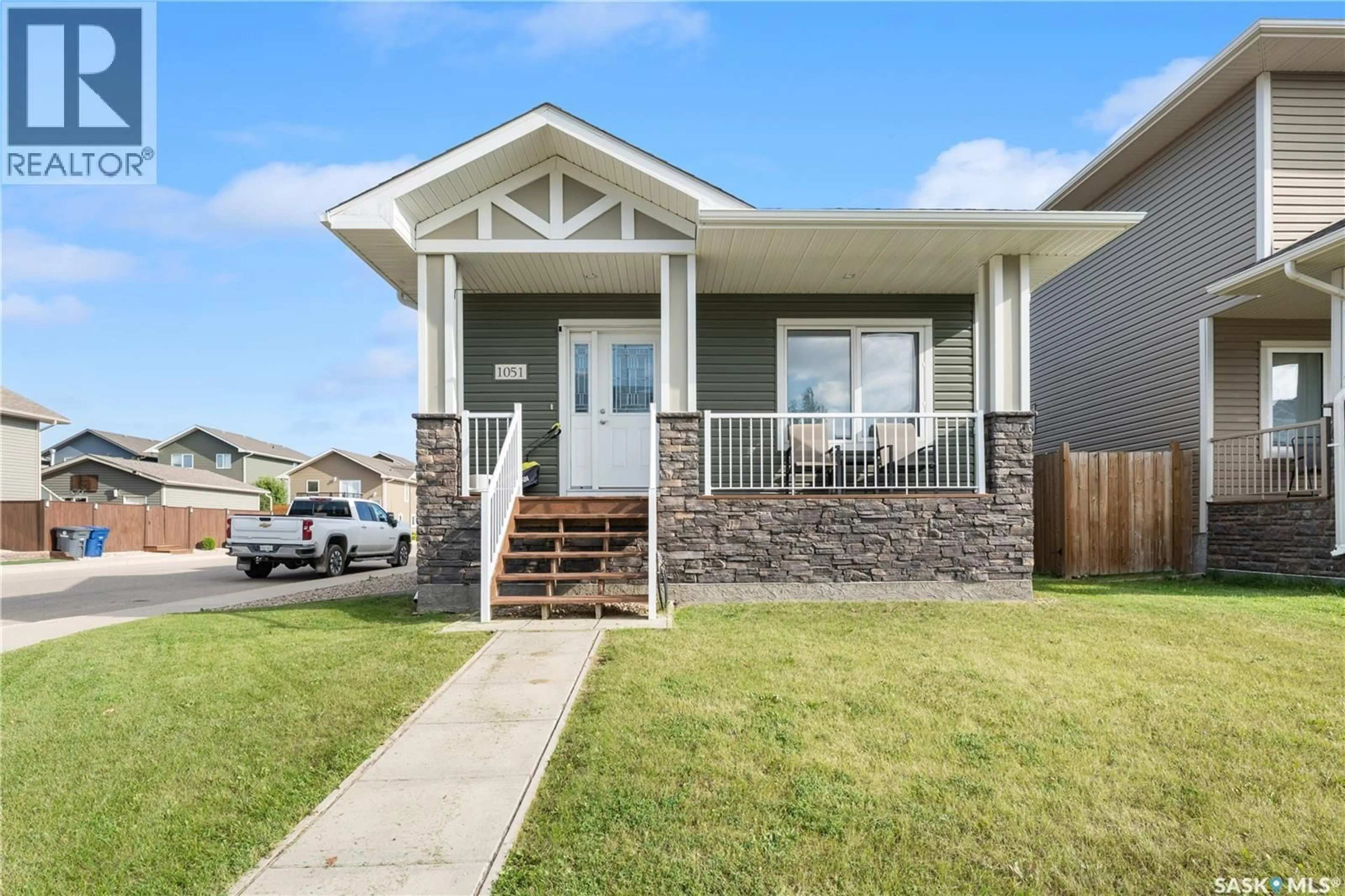 Home with vinyl exterior material, street for 1051 PARR HILL DRIVE, Martensville Saskatchewan S0K2T1