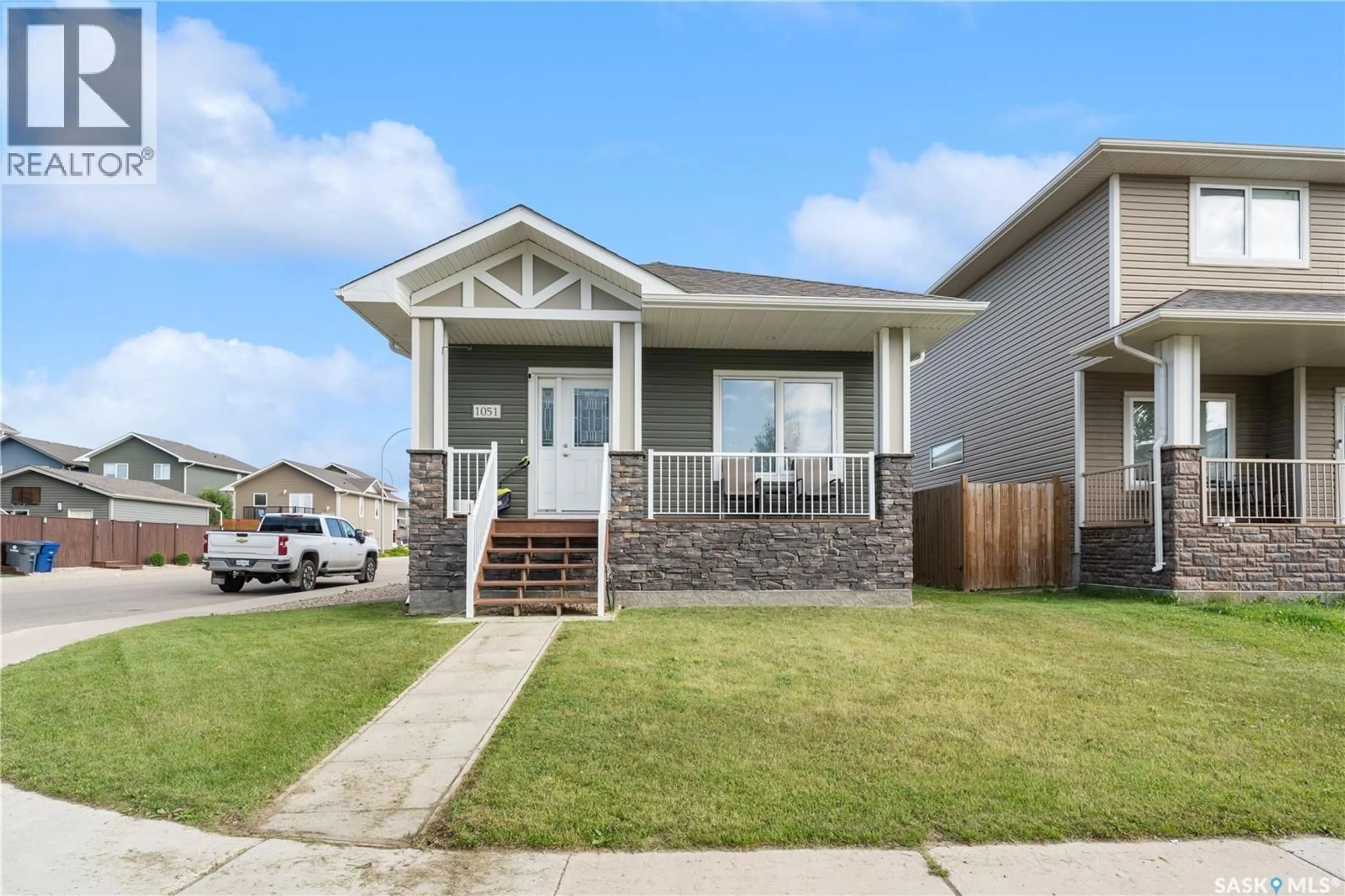 Home with vinyl exterior material, street for 1051 PARR HILL DRIVE, Martensville Saskatchewan S0K2T1