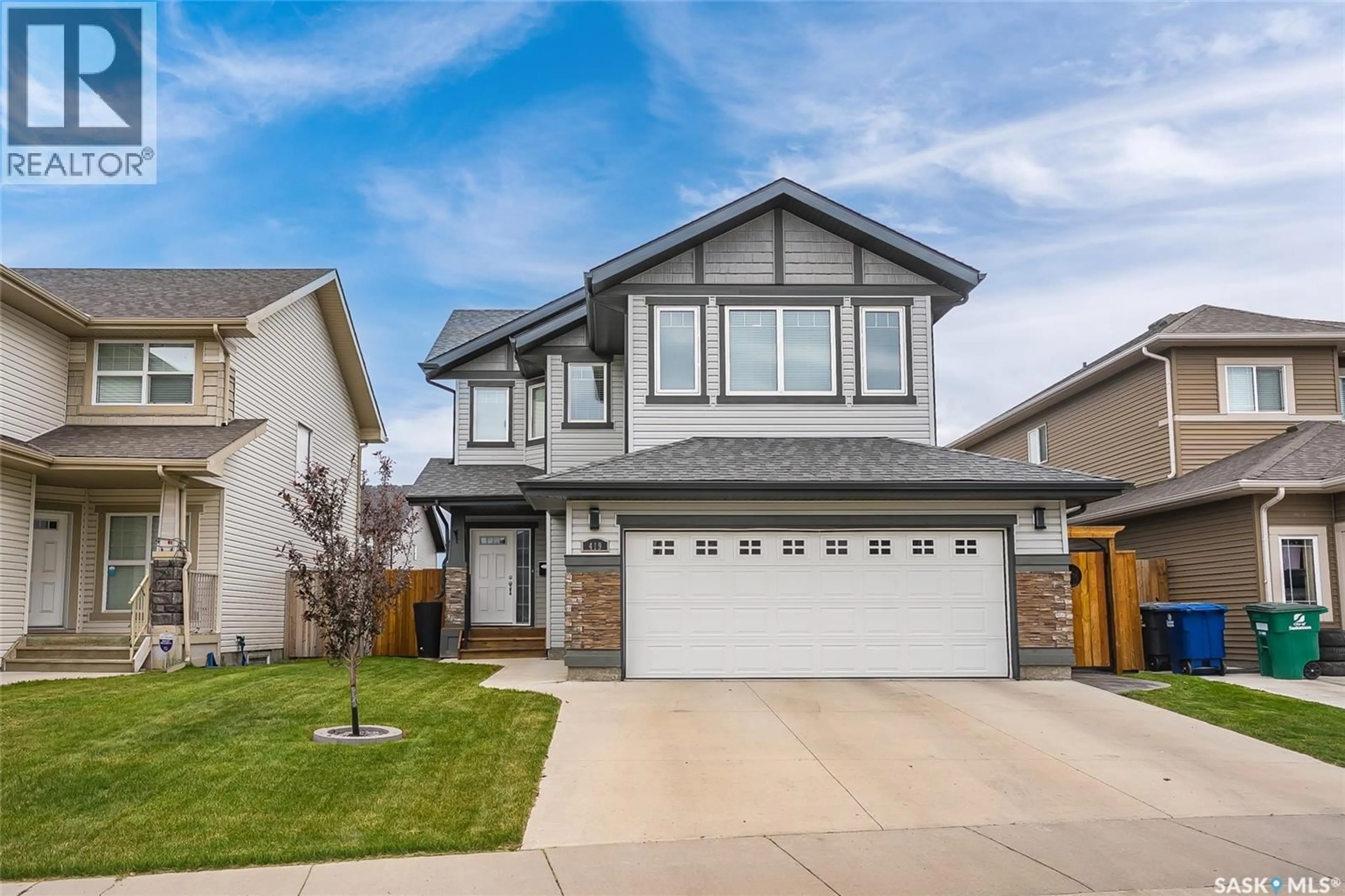 Home with vinyl exterior material, street for 419 KENSINGTON BOULEVARD, Saskatoon Saskatchewan S7L6N7