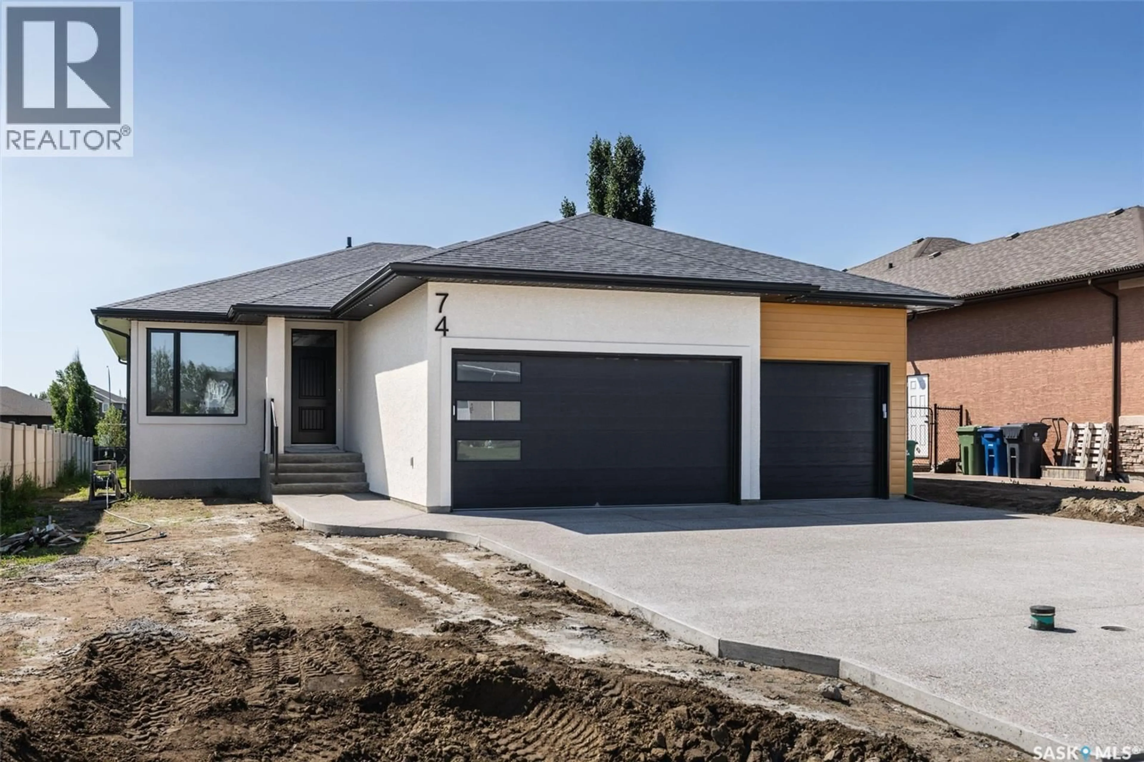 Home with brick exterior material, street for E - 74 EMERALD RIDGE, White City Saskatchewan S4L0A8