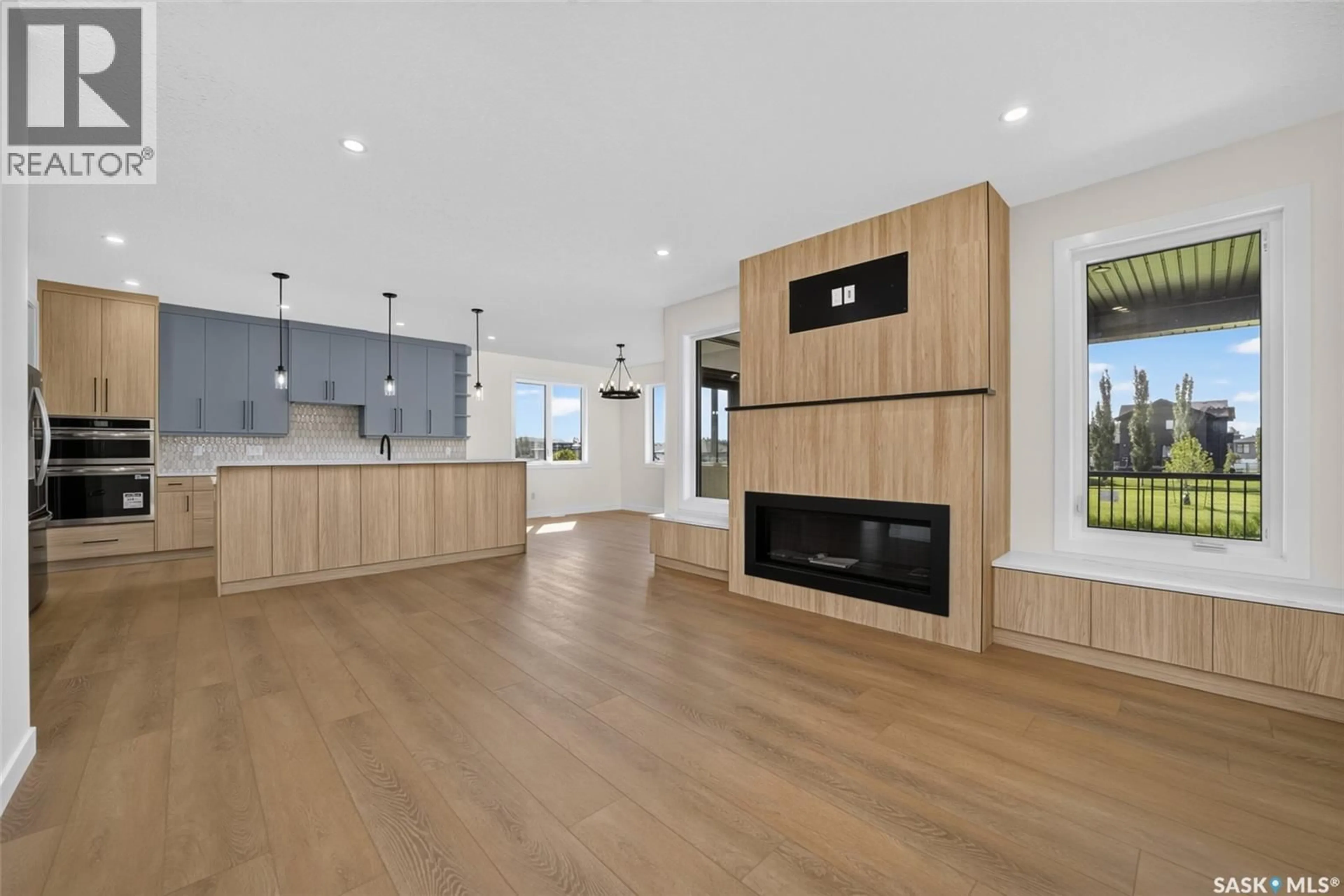 Open concept kitchen, wood/laminate floor for E - 74 EMERALD RIDGE, White City Saskatchewan S4L0A8