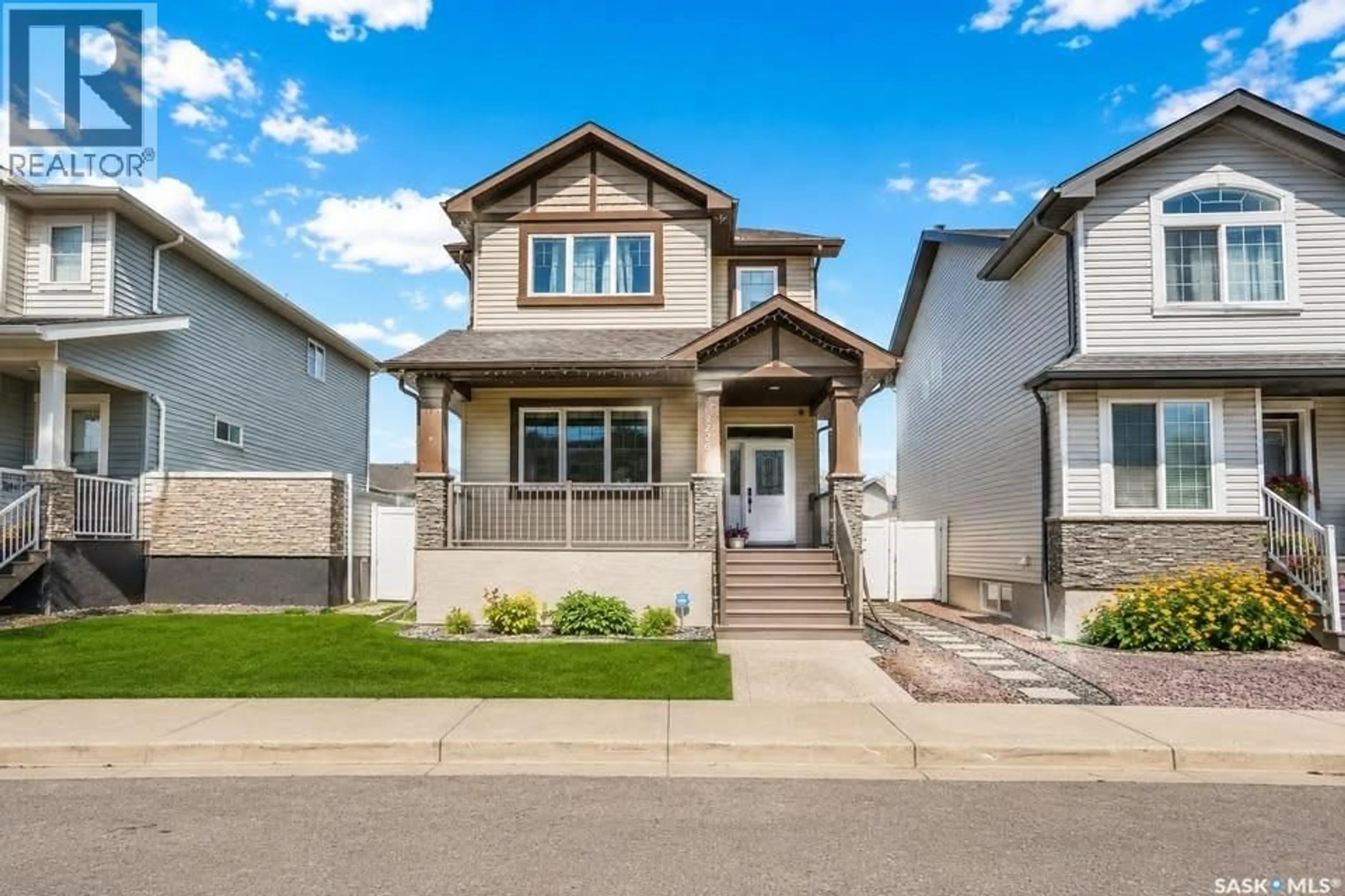 Home with vinyl exterior material, street for 8726 ARCHER LANE, Regina Saskatchewan S4Y0B7