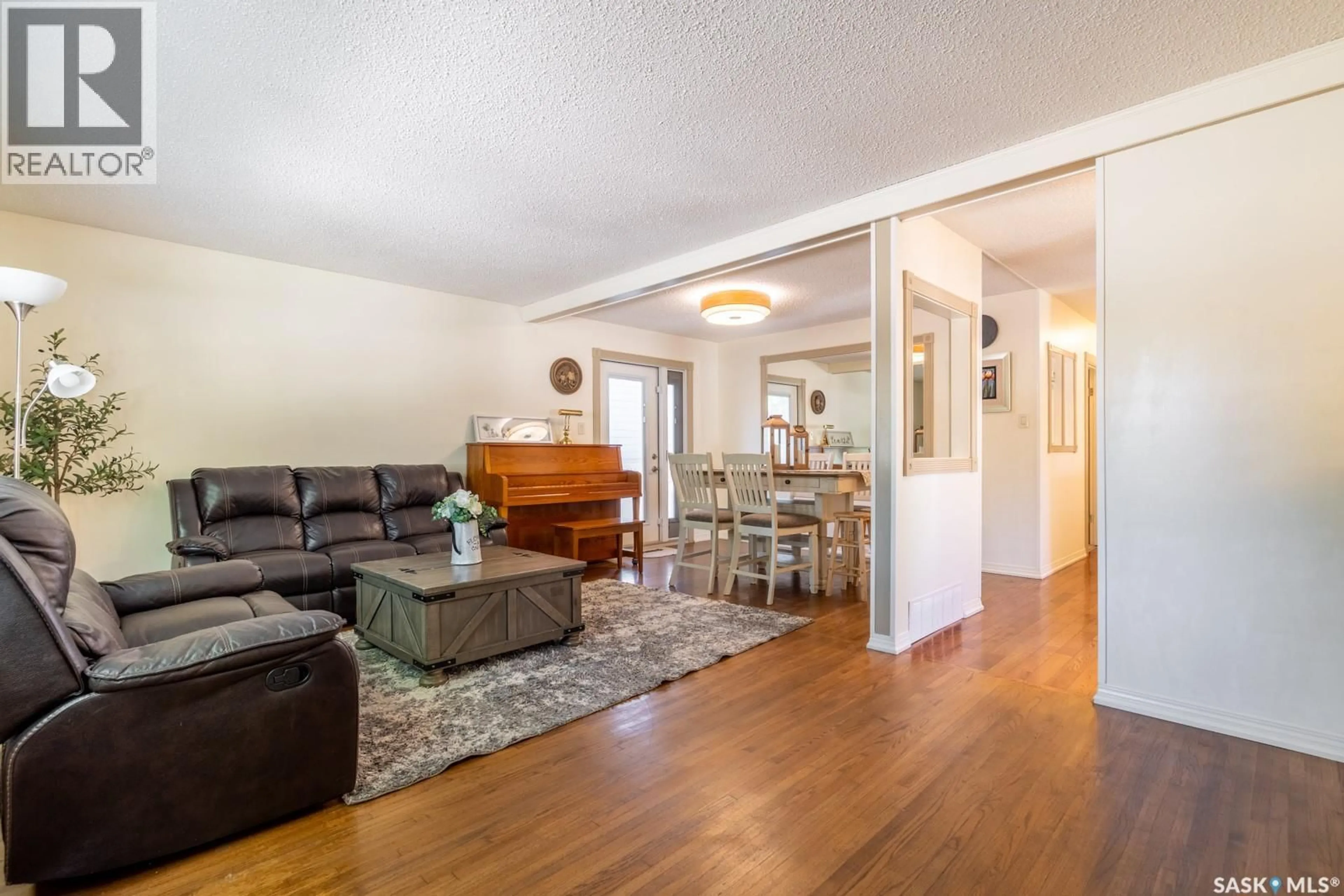 Living room with furniture, wood/laminate floor for 24 MAYFAIR CRESCENT, Regina Saskatchewan S4S4H5
