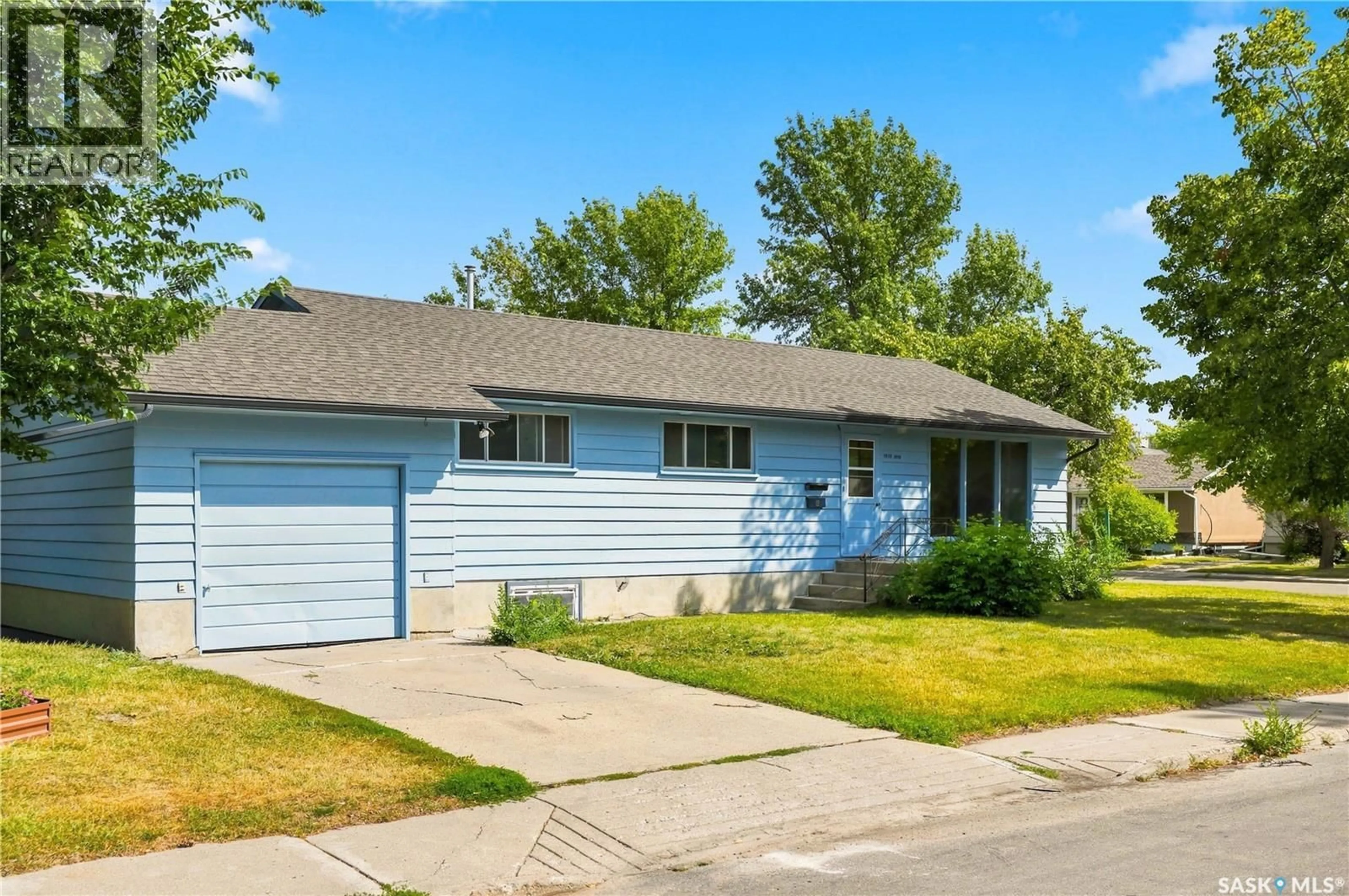 Home with vinyl exterior material, street for 1401 10TH STREET, Saskatoon Saskatchewan S7H0J4