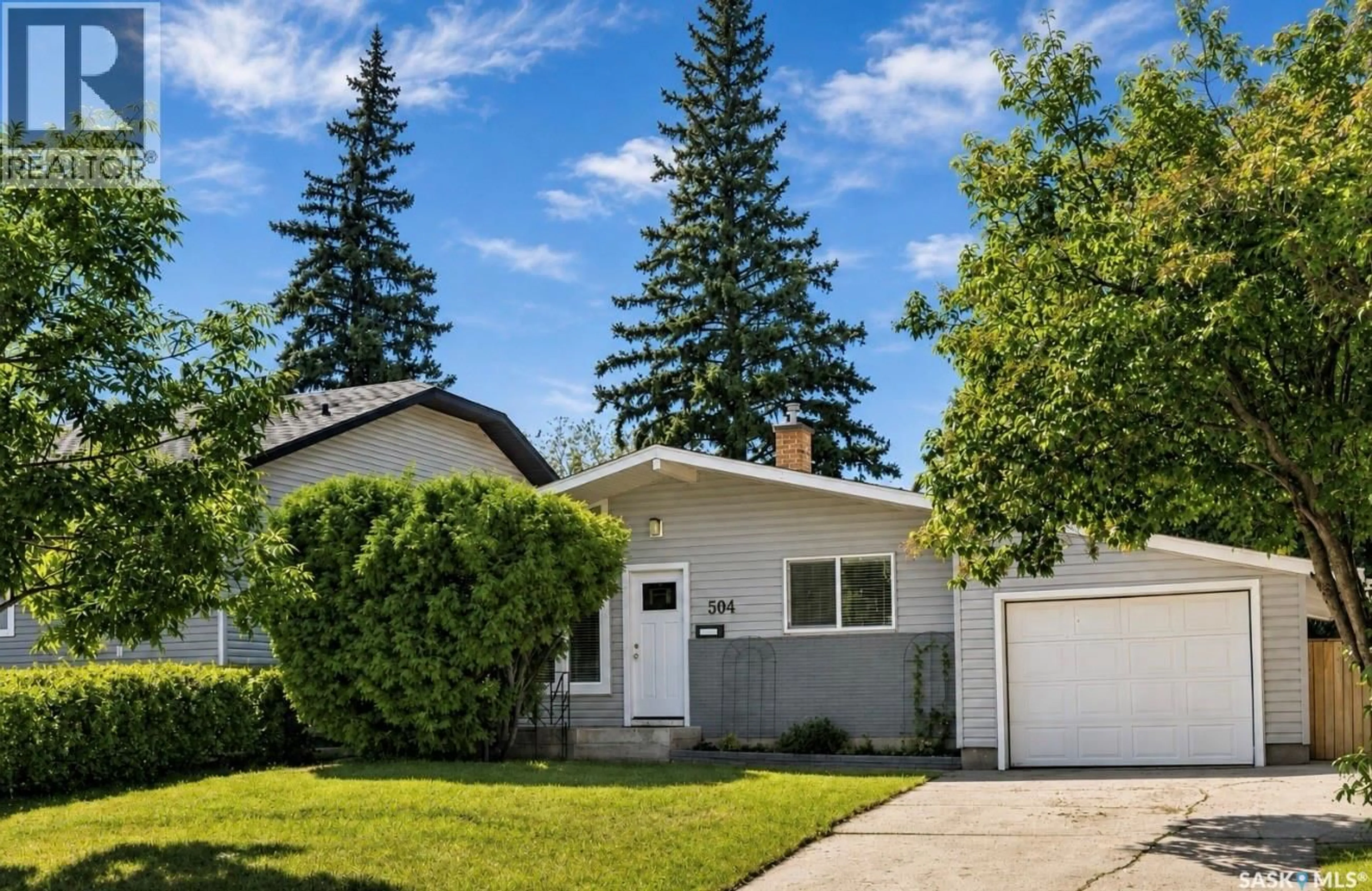 Home with vinyl exterior material, street for 504 LESLIE AVENUE, Saskatoon Saskatchewan S7H2Z1