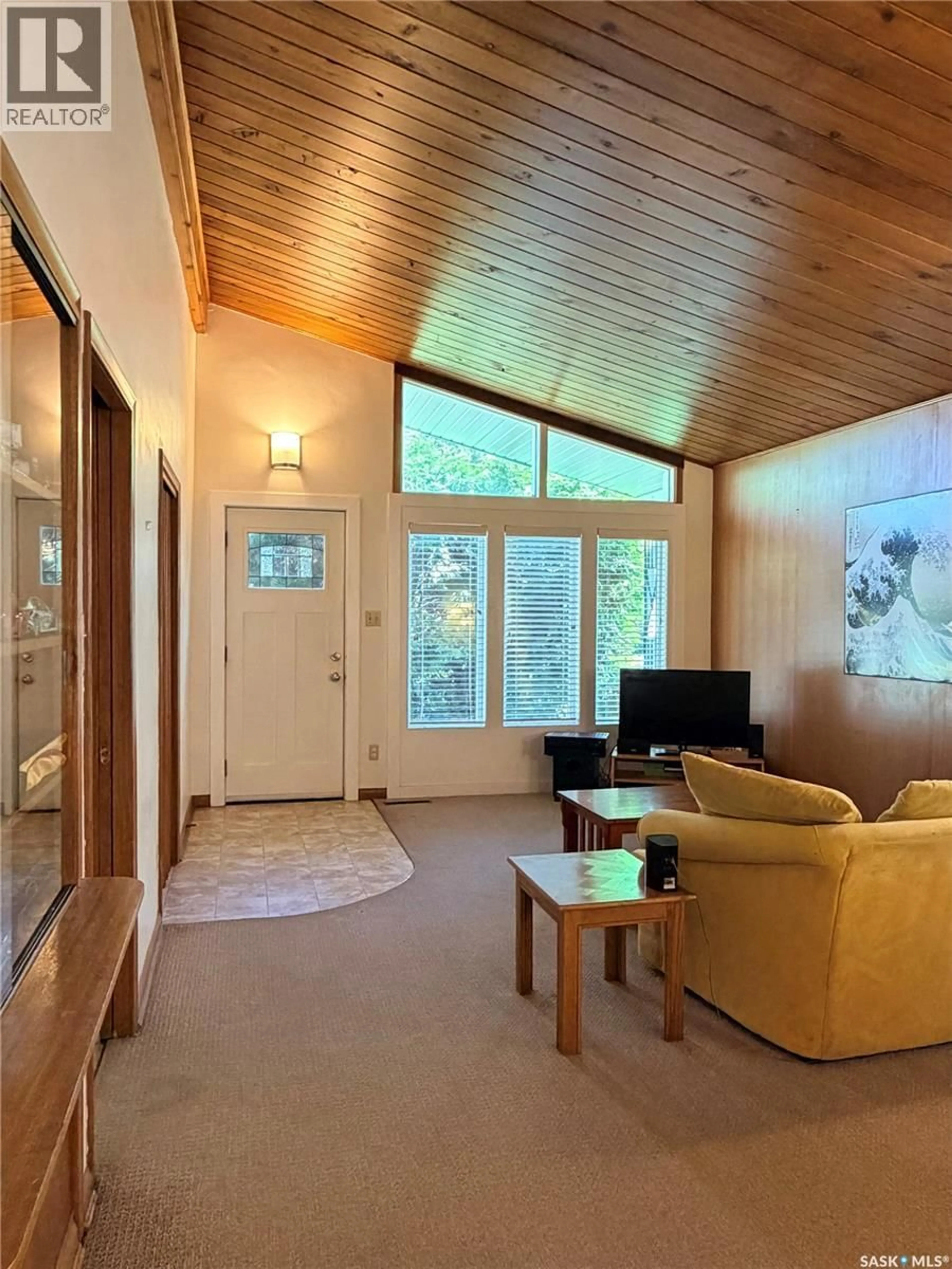 Living room with furniture, wood/laminate floor for 504 LESLIE AVENUE, Saskatoon Saskatchewan S7H2Z1