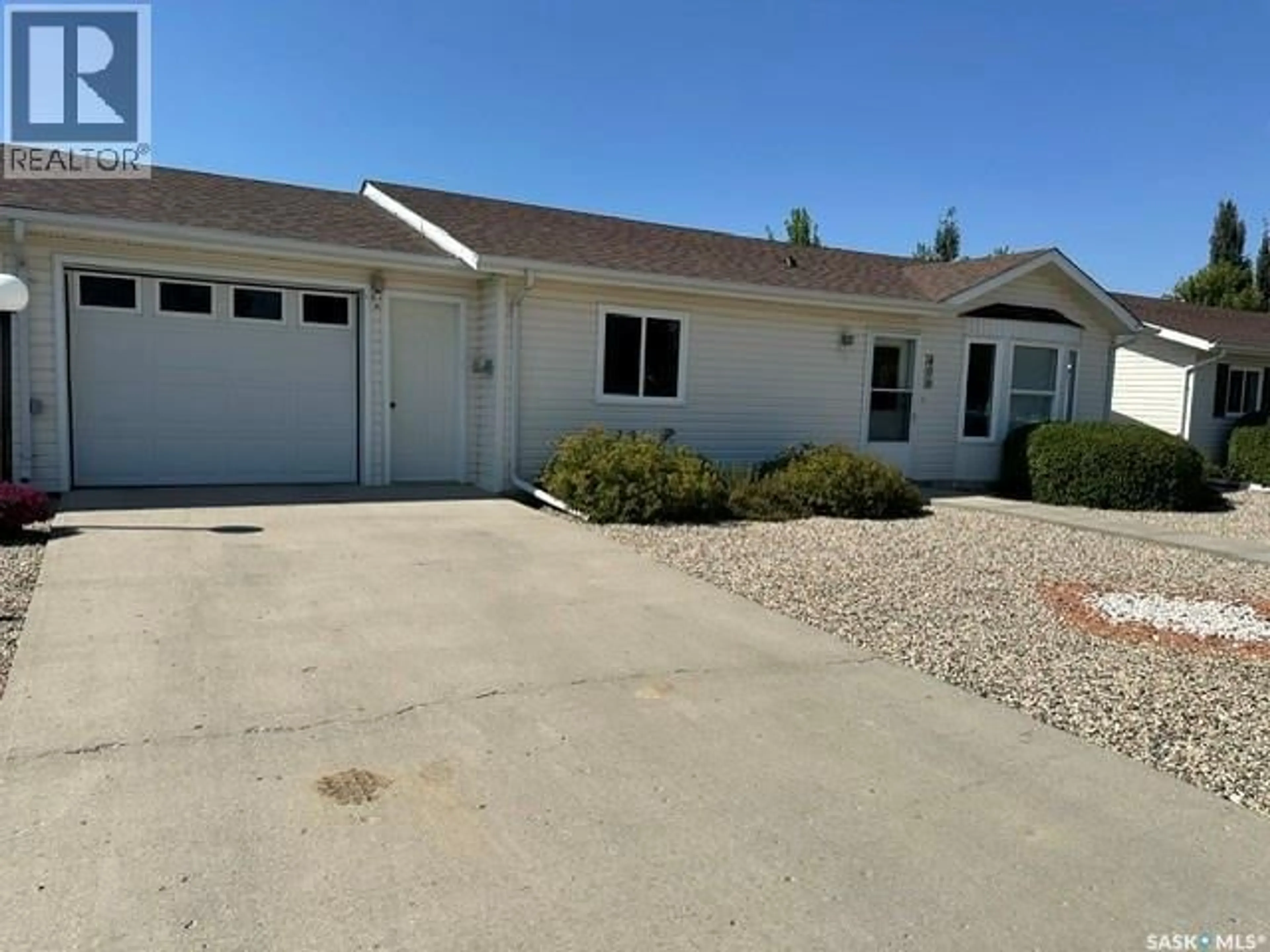 Home with vinyl exterior material, street for 406 8TH AVENUE, Kipling Saskatchewan S0G0S0