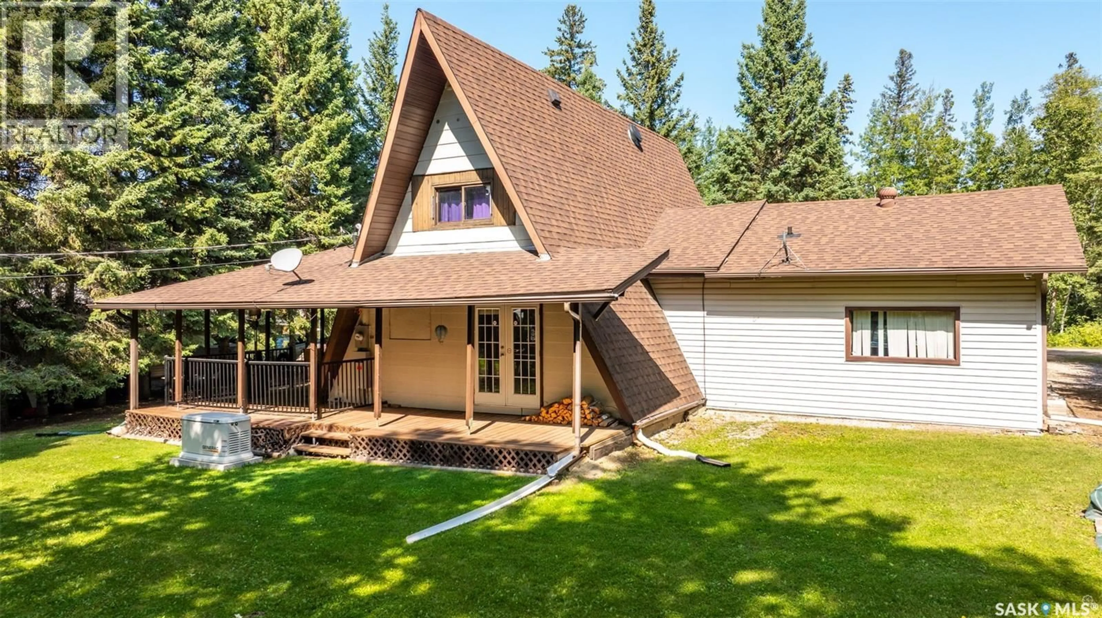 Home with vinyl exterior material, mountain view for 321 JACOBSON DRIVE, Christopher Lake Saskatchewan S0J0N0