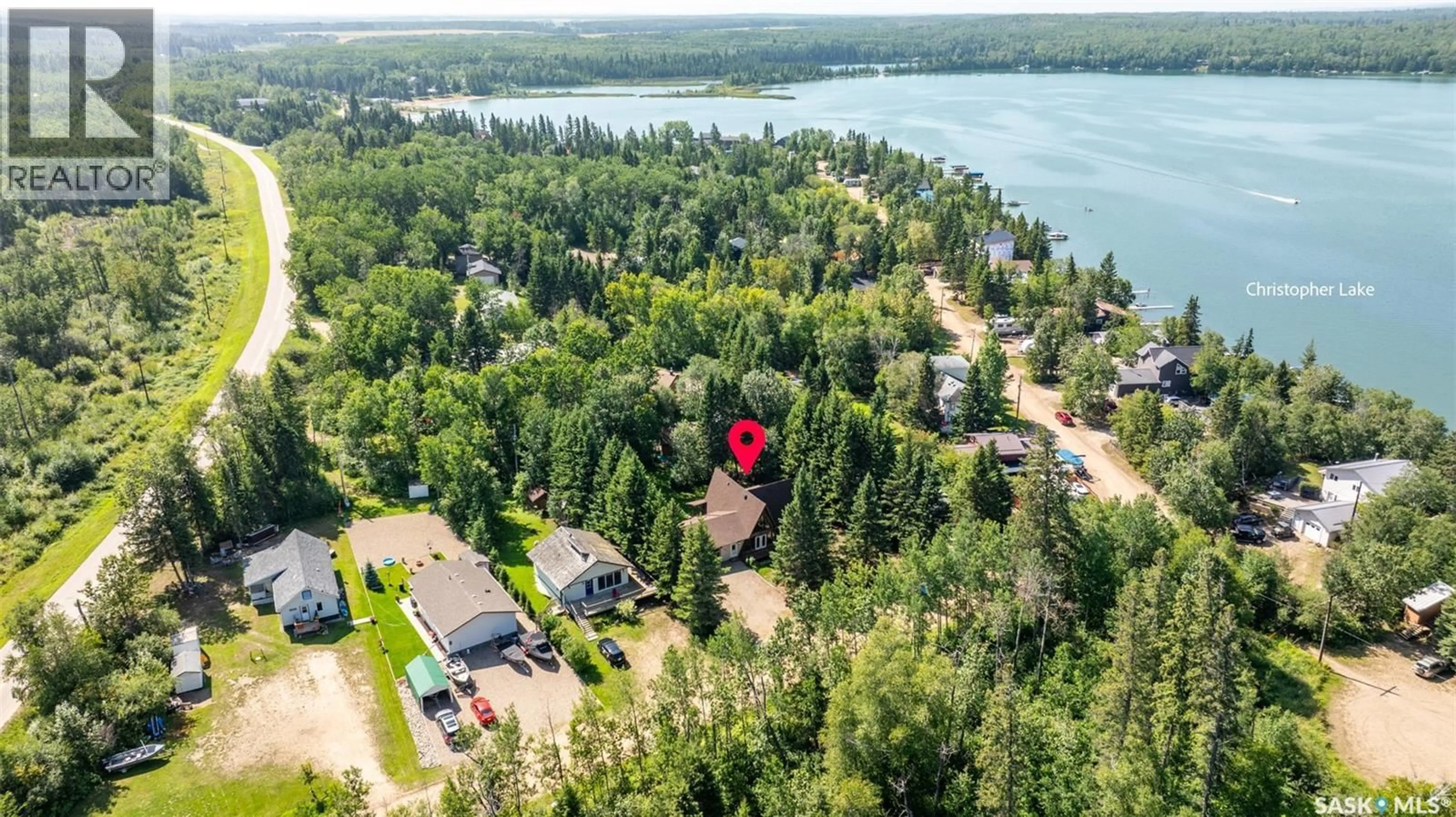 A pic from outside/outdoor area/front of a property/back of a property/a pic from drone, water/lake/river/ocean view for 321 JACOBSON DRIVE, Christopher Lake Saskatchewan S0J0N0