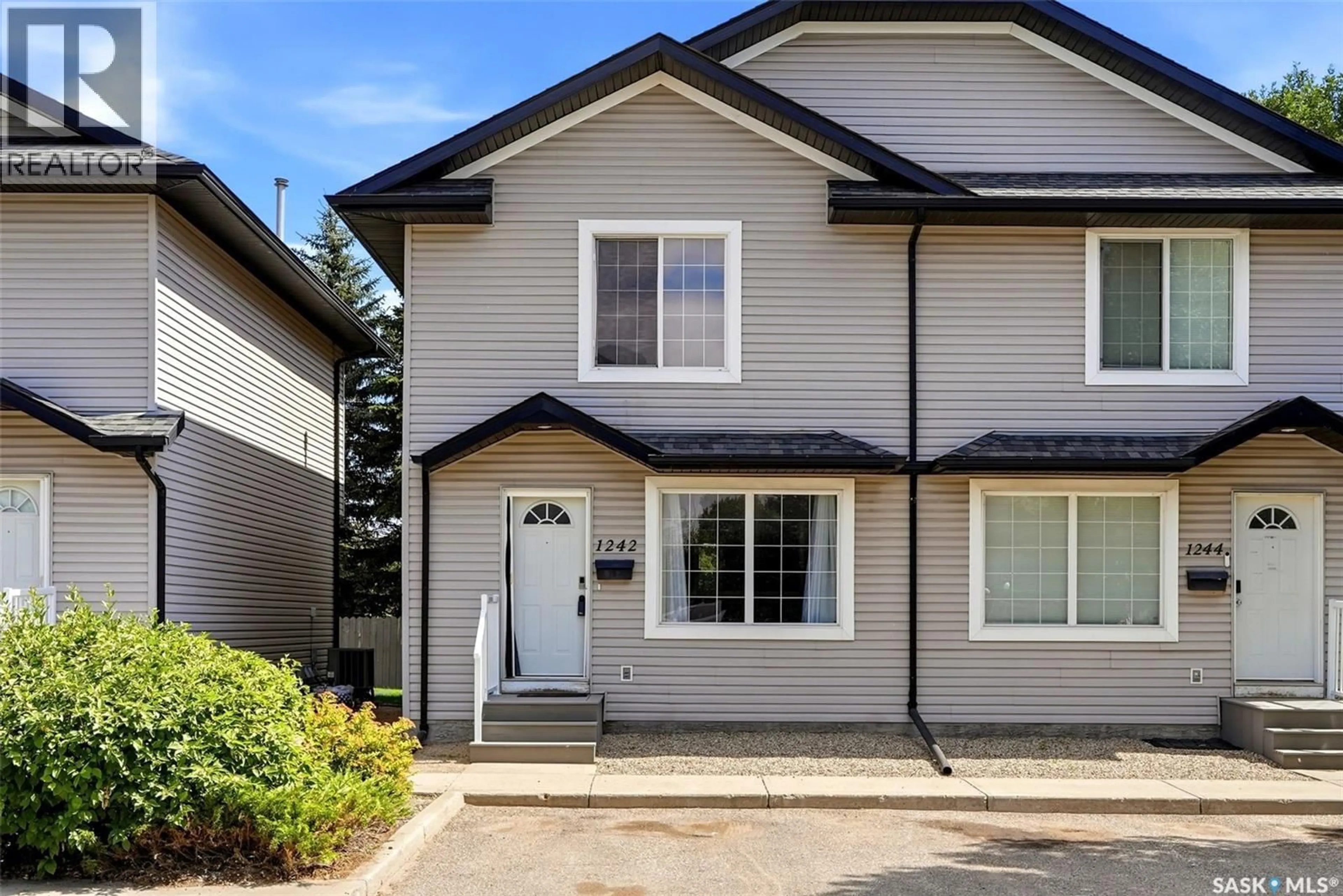 Home with vinyl exterior material, street for 1242 WESSEX PLACE, Regina Saskatchewan S4N7S2