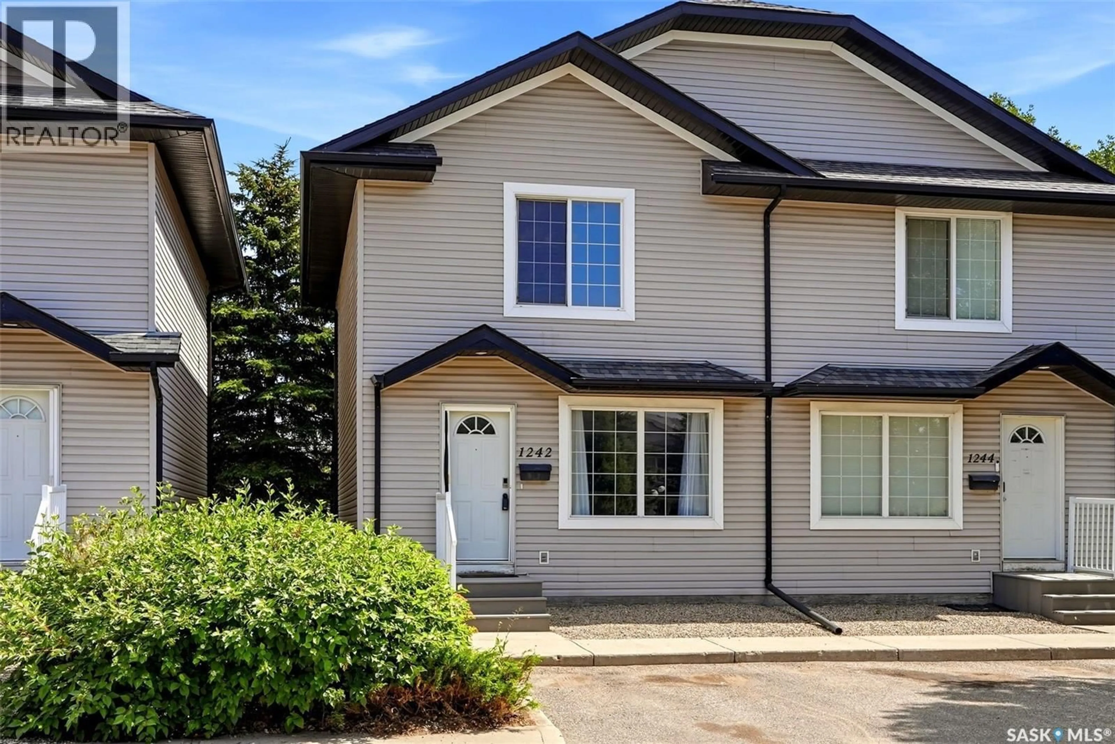 Home with vinyl exterior material, street for 1242 WESSEX PLACE, Regina Saskatchewan S4N7S2
