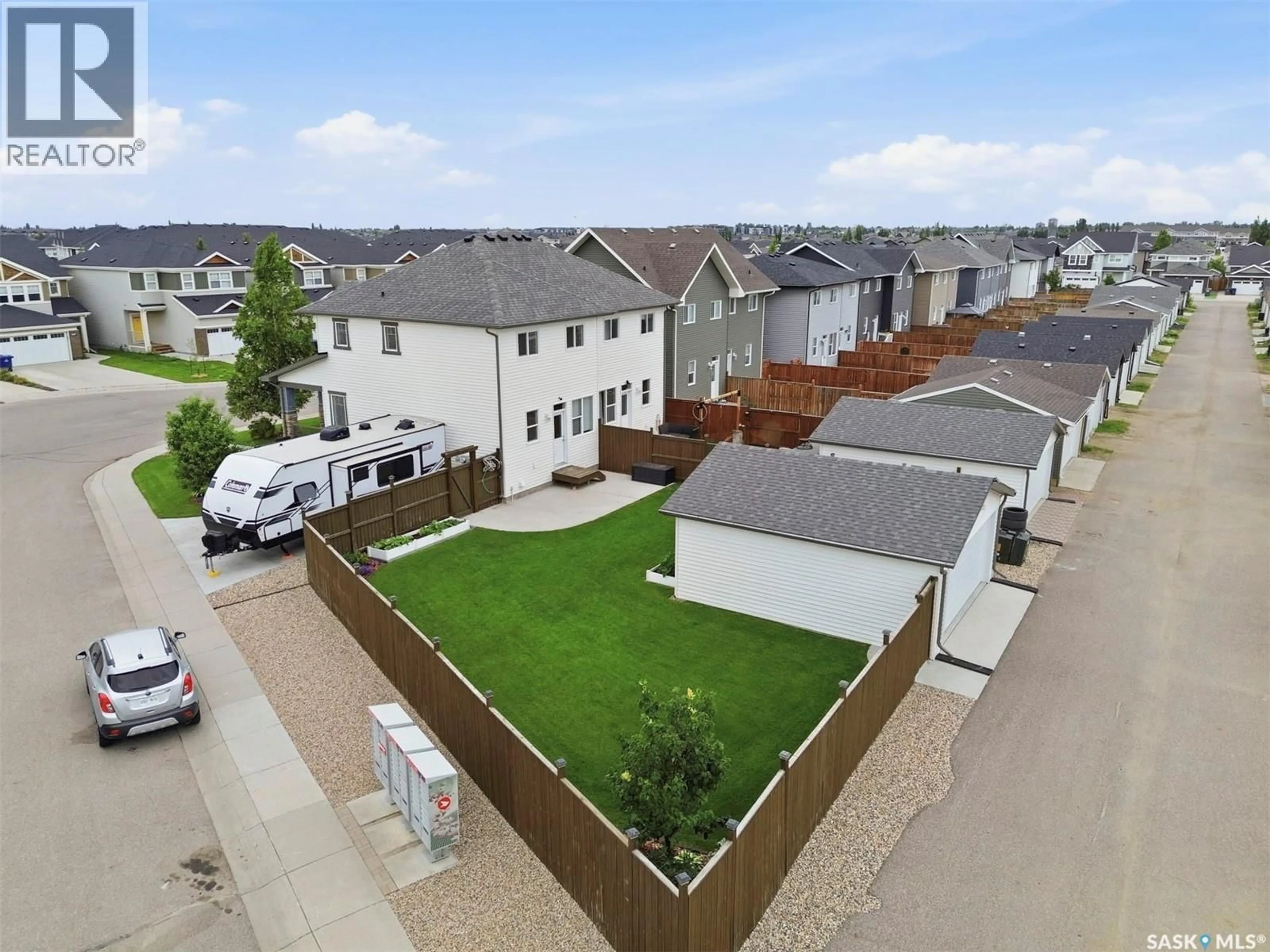 A pic from outside/outdoor area/front of a property/back of a property/a pic from drone, street for 1040 KOLYNCHUK CRESCENT, Saskatoon Saskatchewan S7T0X4