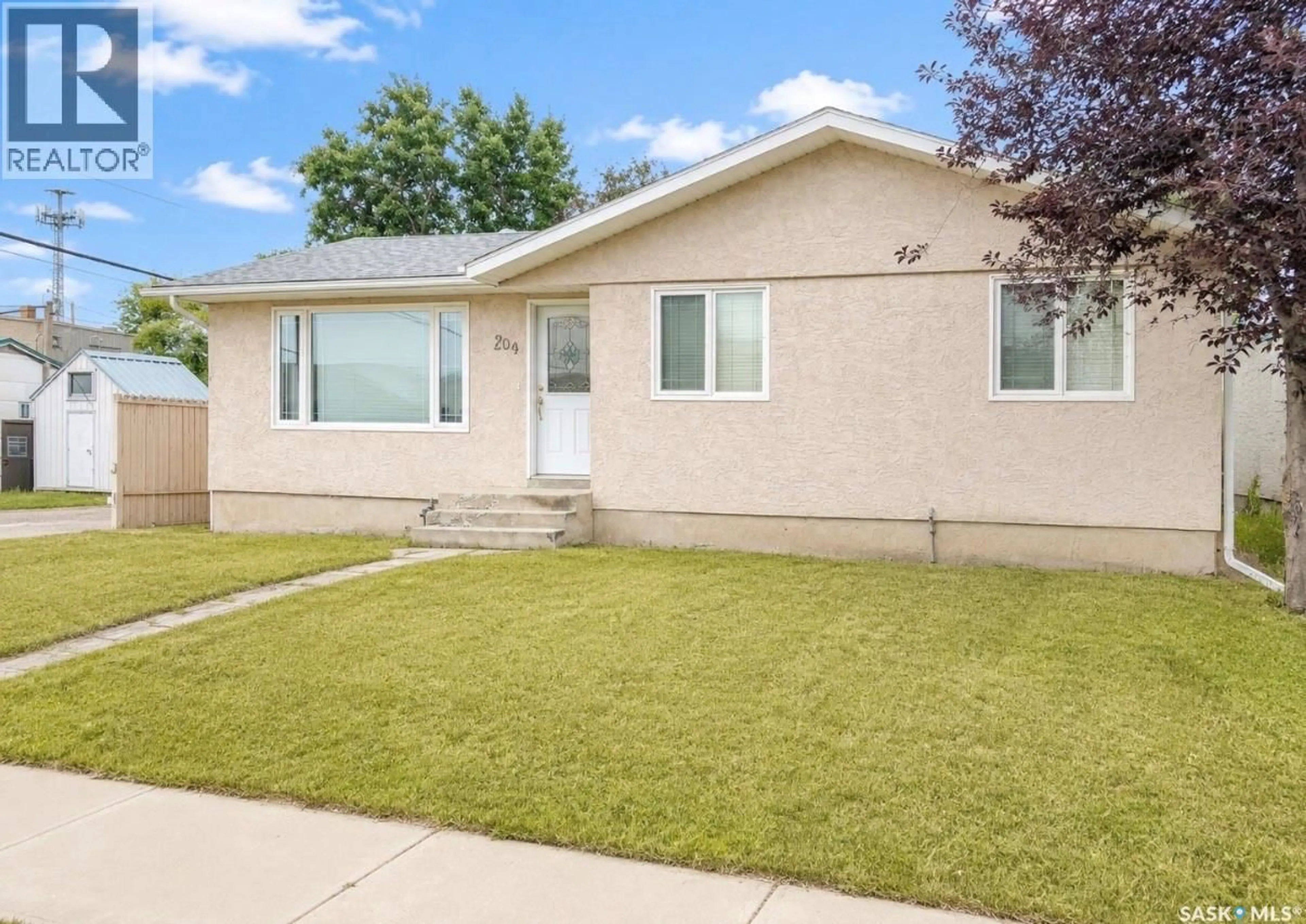 Home with vinyl exterior material, street for 204 BROWNLEE STREET, Herbert Saskatchewan S0H2A0