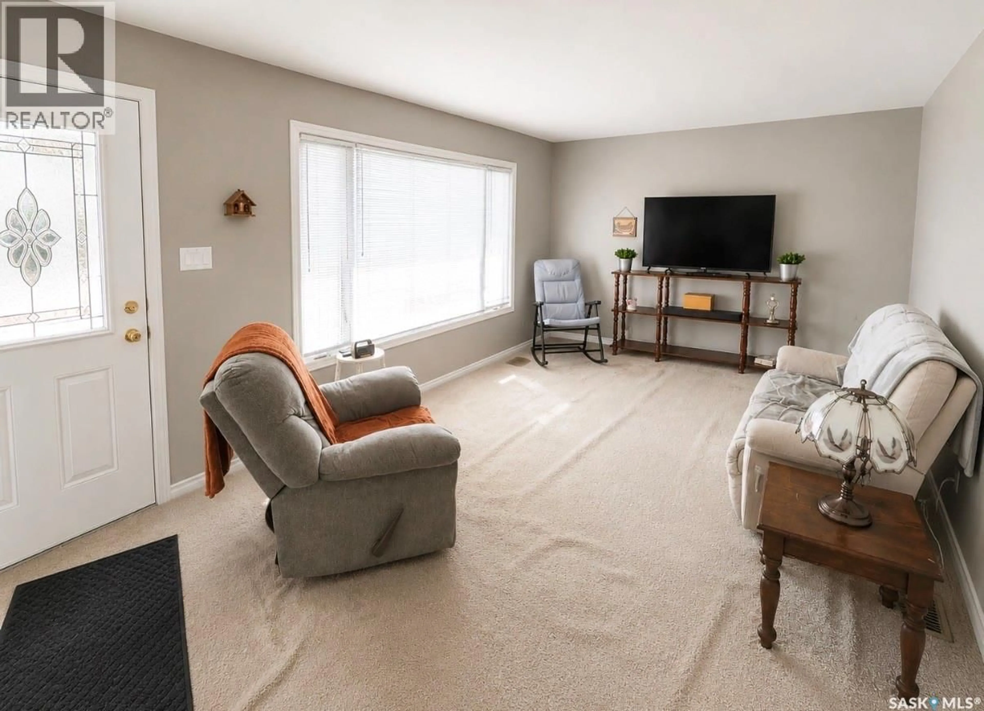 Living room with furniture, carpet floor for 204 BROWNLEE STREET, Herbert Saskatchewan S0H2A0