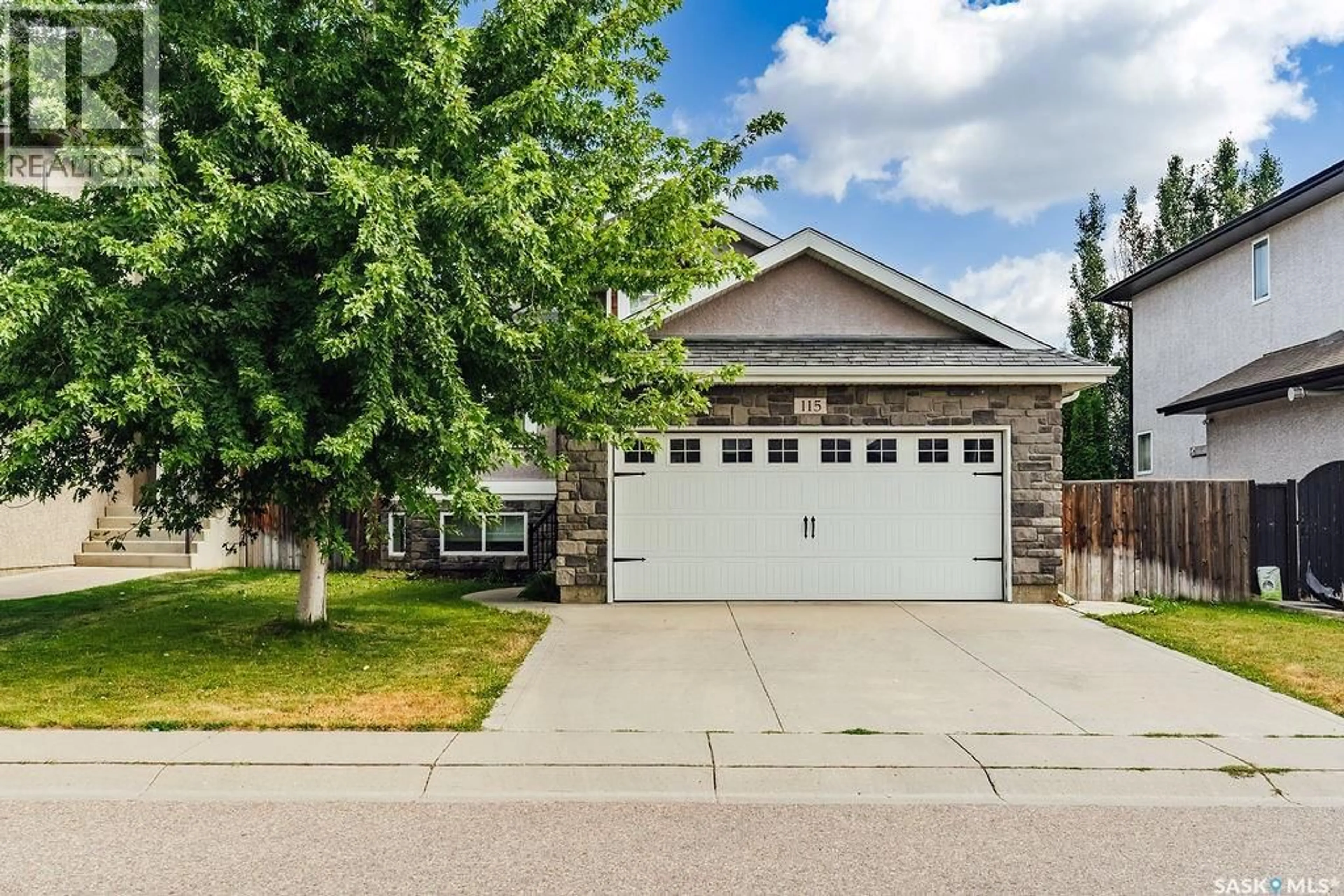 Home with vinyl exterior material, street for 115 BLACKSTOCK COVE, Saskatoon Saskatchewan S7T0H4