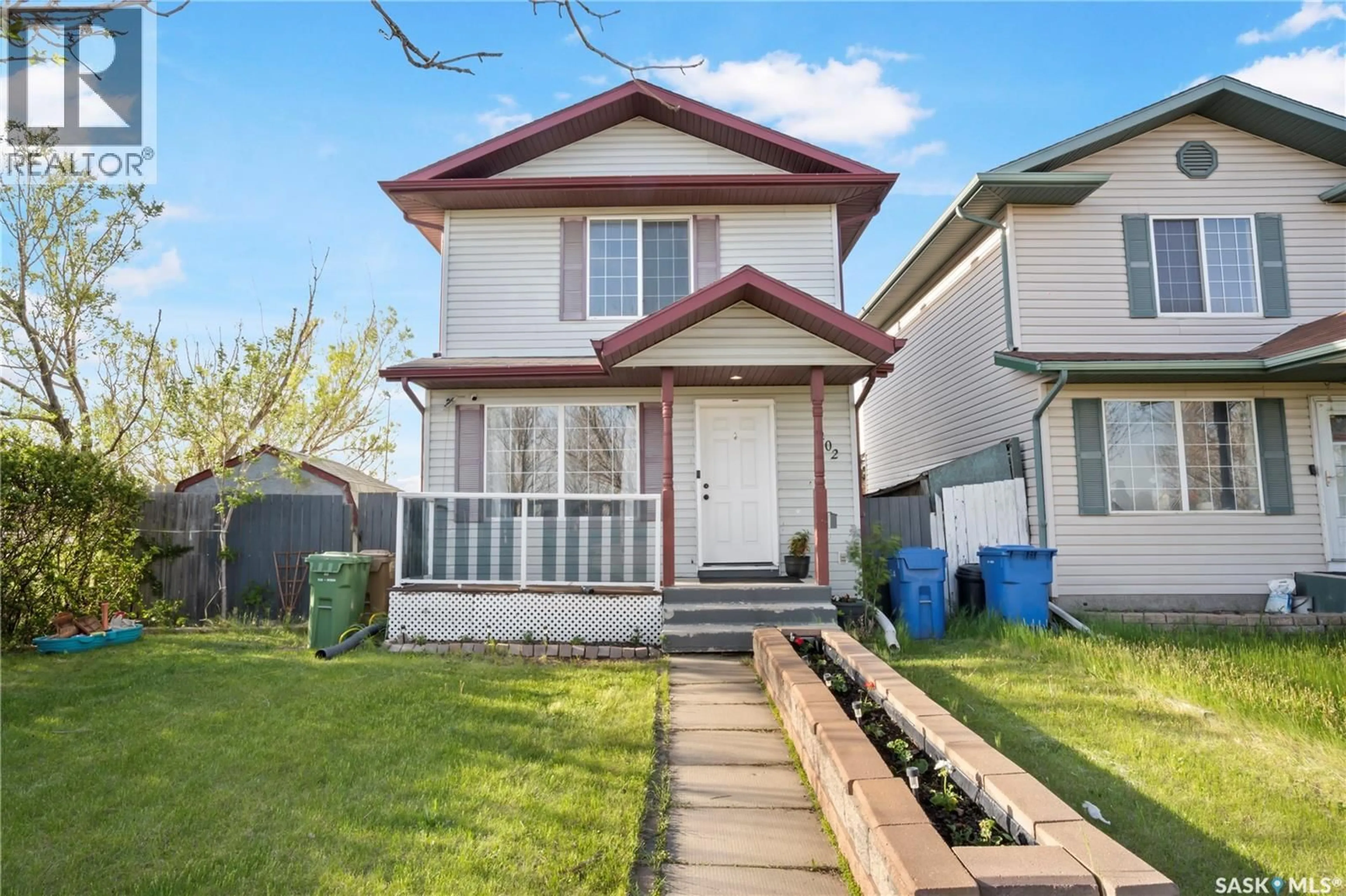 Home with vinyl exterior material, street for 1402 10TH AVENUE, Regina Saskatchewan S4N7P6