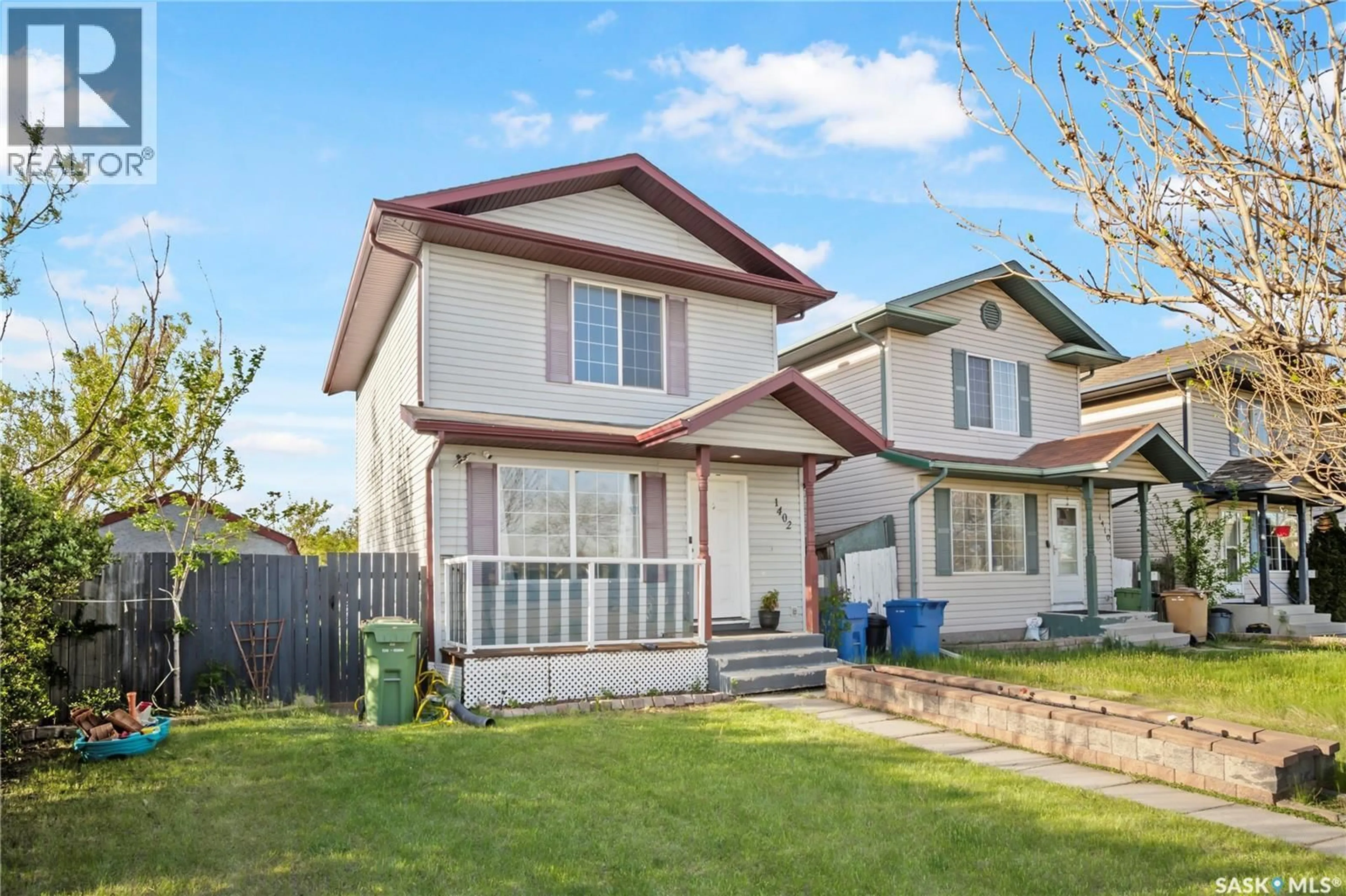 Home with vinyl exterior material, street for 1402 10TH AVENUE, Regina Saskatchewan S4N7P6