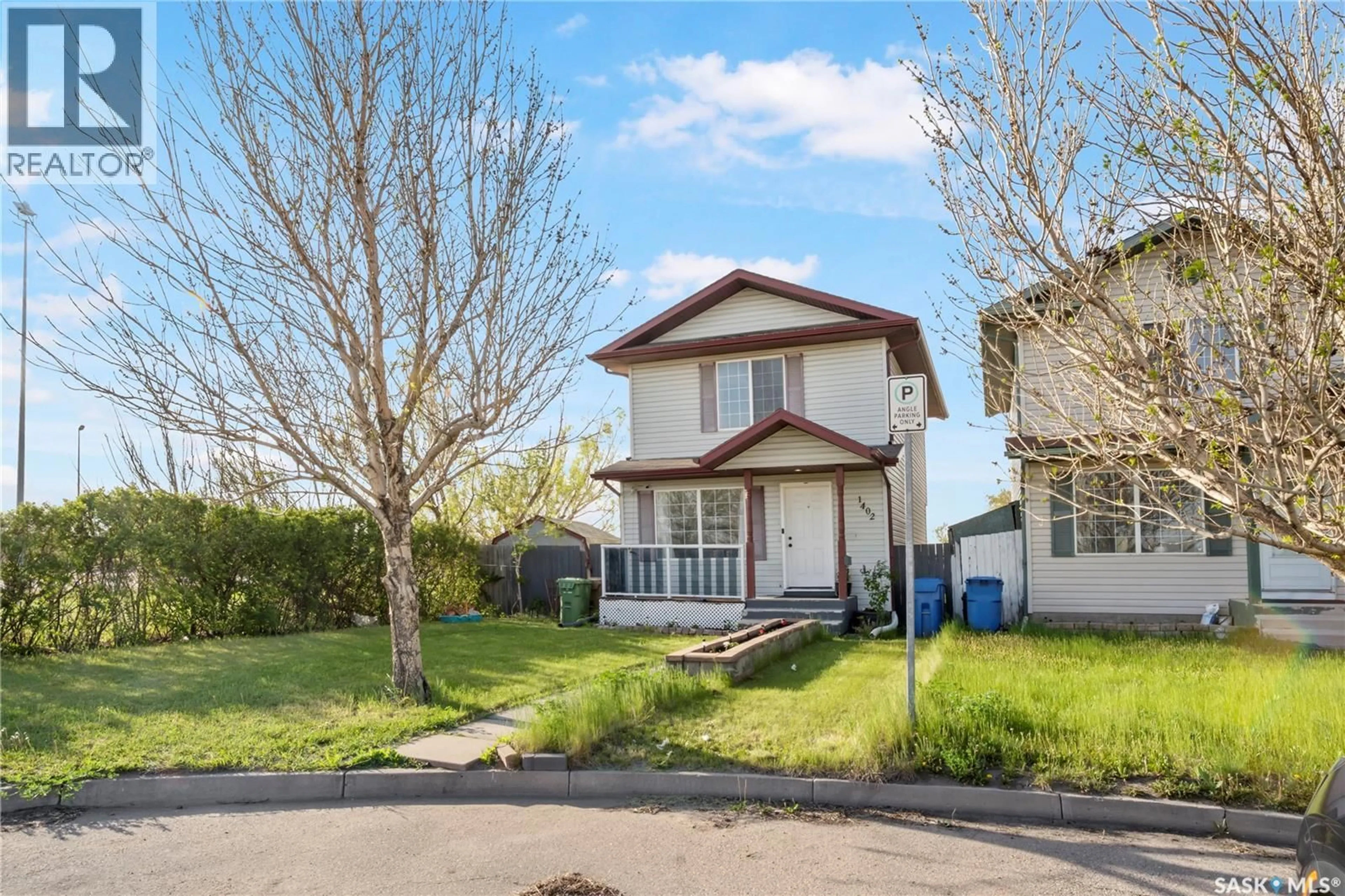 Home with vinyl exterior material, street for 1402 10TH AVENUE, Regina Saskatchewan S4N7P6