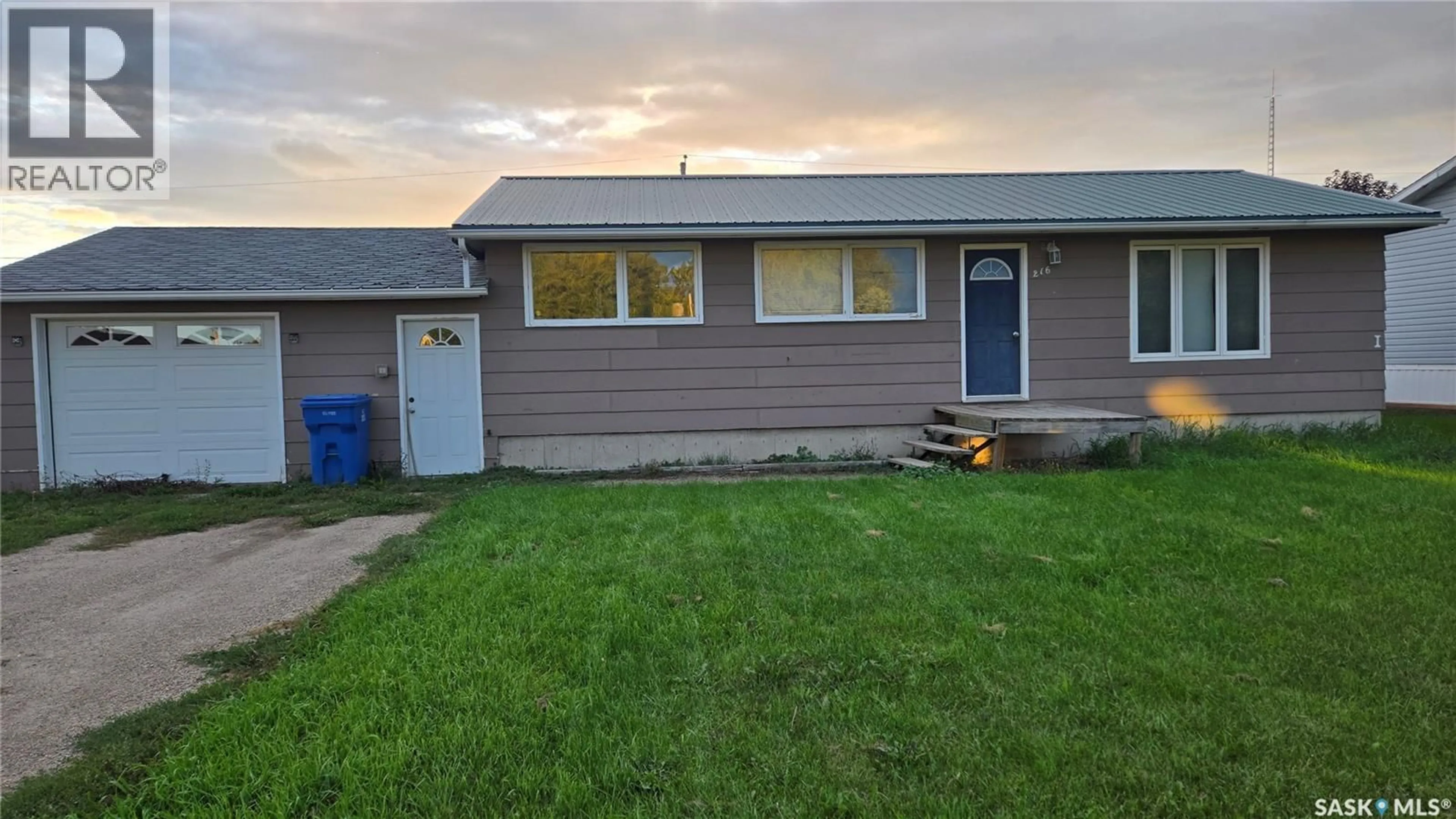 Home with vinyl exterior material, street for 216 1ST STREET, Carnduff Saskatchewan S0C0S0
