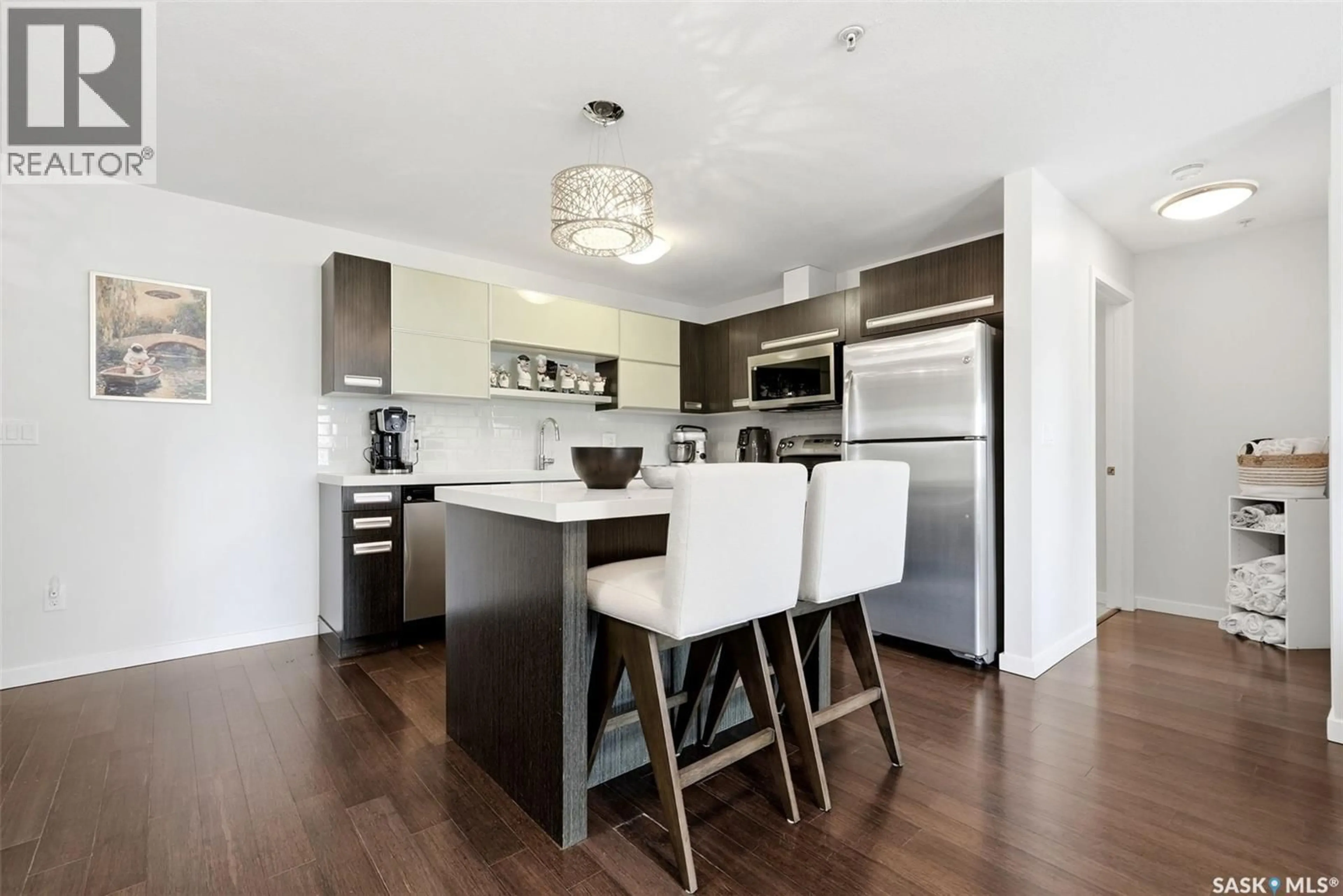 Open concept kitchen, wood/laminate floor for 205 - 1610 DAKOTA DRIVE, Regina Saskatchewan S4Z0A5