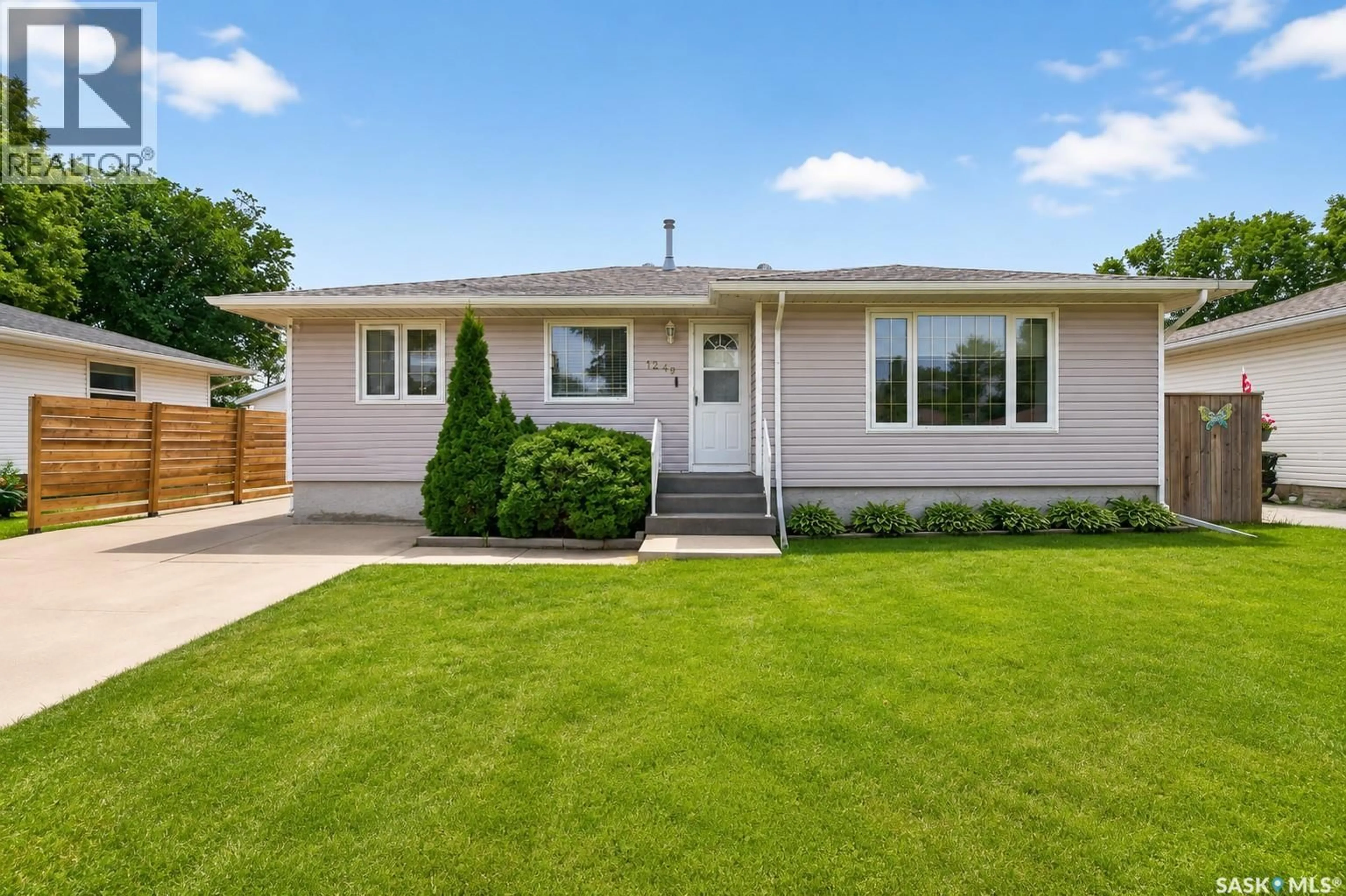 Home with vinyl exterior material, street for 1249 GRACE STREET, Moose Jaw Saskatchewan S6H3C6