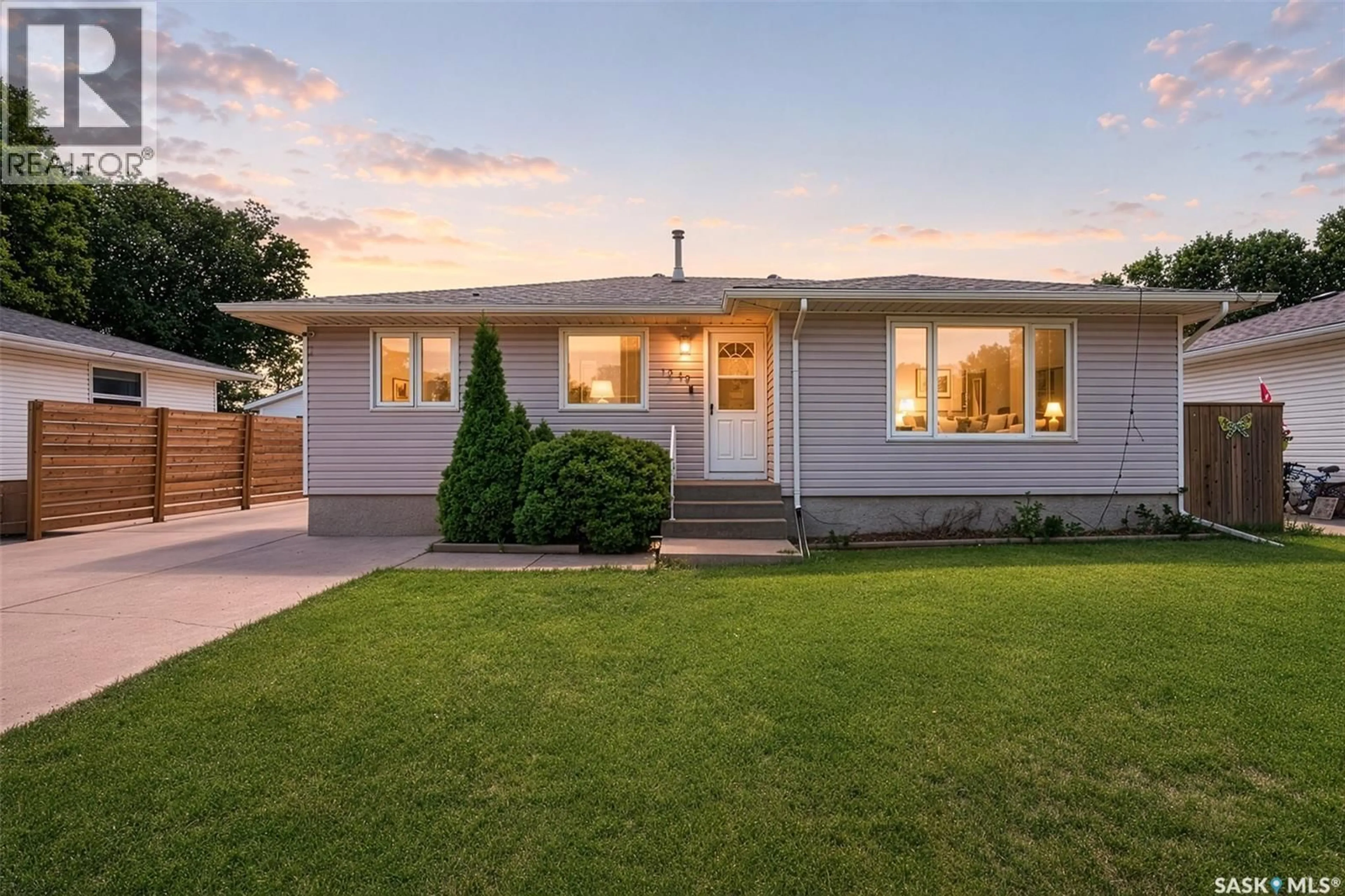 Home with vinyl exterior material, street for 1249 GRACE STREET, Moose Jaw Saskatchewan S6H3C6