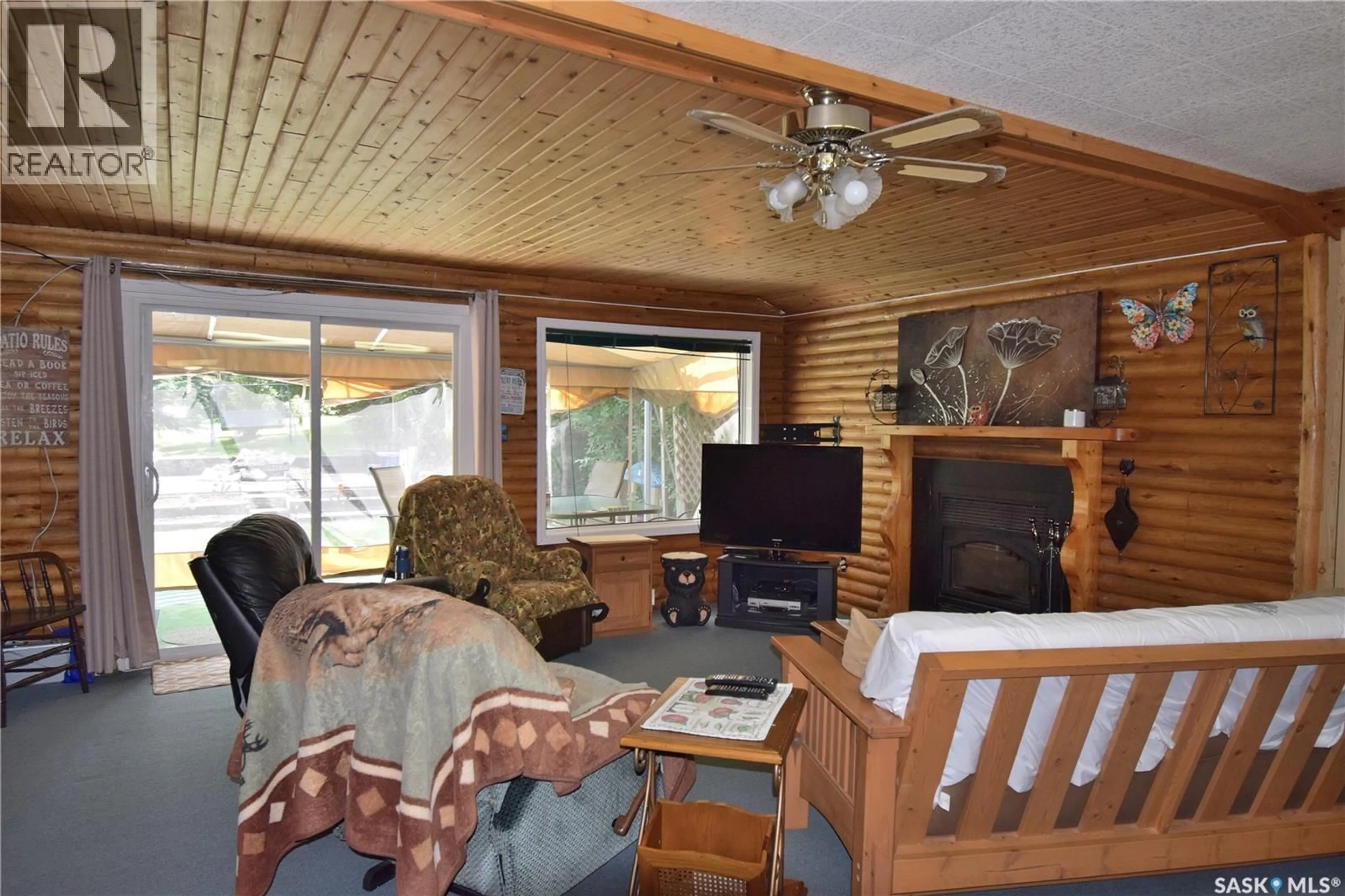 Living room with furniture, wood/laminate floor for 87 150 OKEMA BEACH ROAD, Emma Lake Saskatchewan S0J0N0