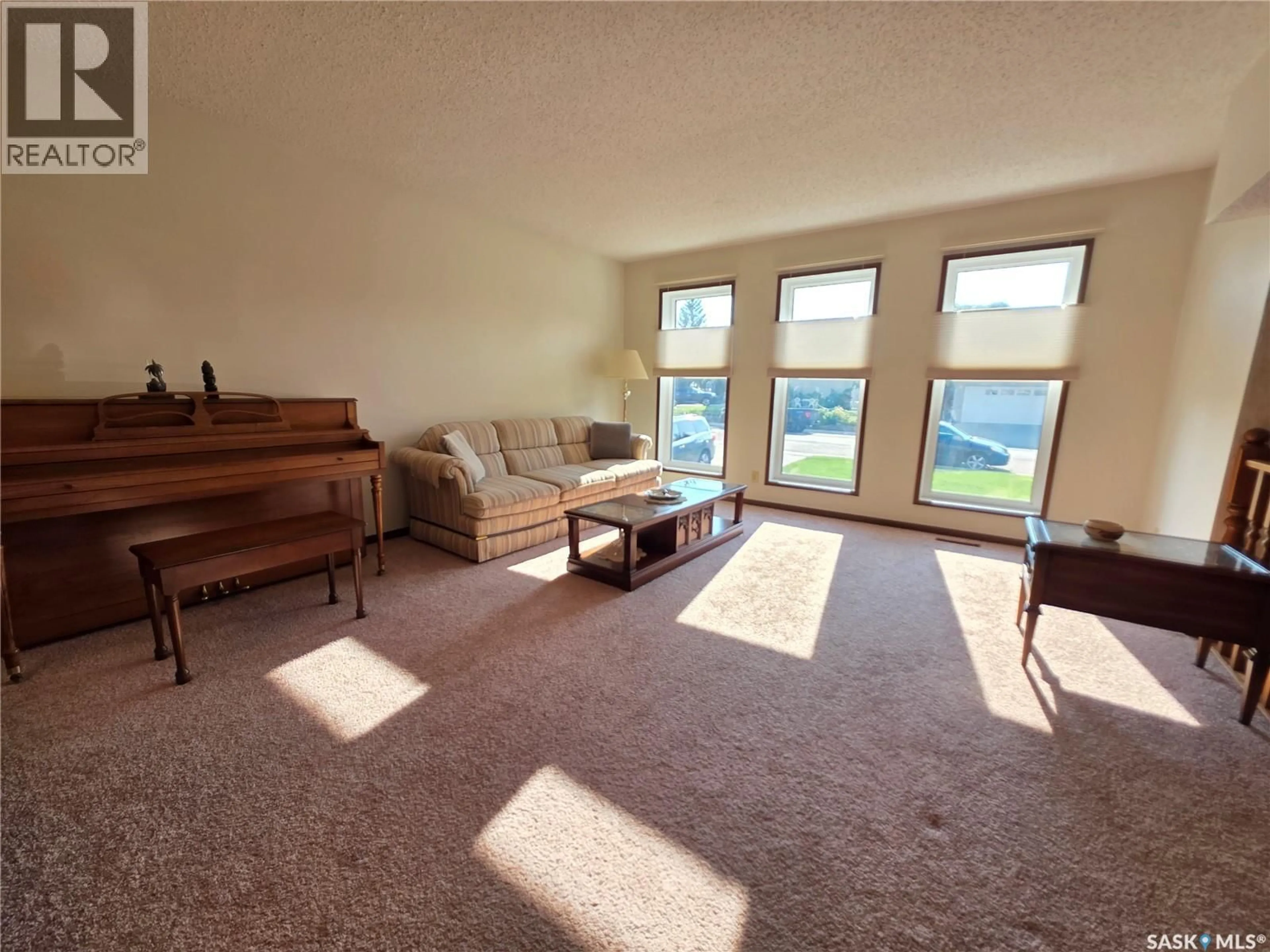 Living room with furniture, unknown for 411 MILBURN CRESCENT, Swift Current Saskatchewan S9H4X8