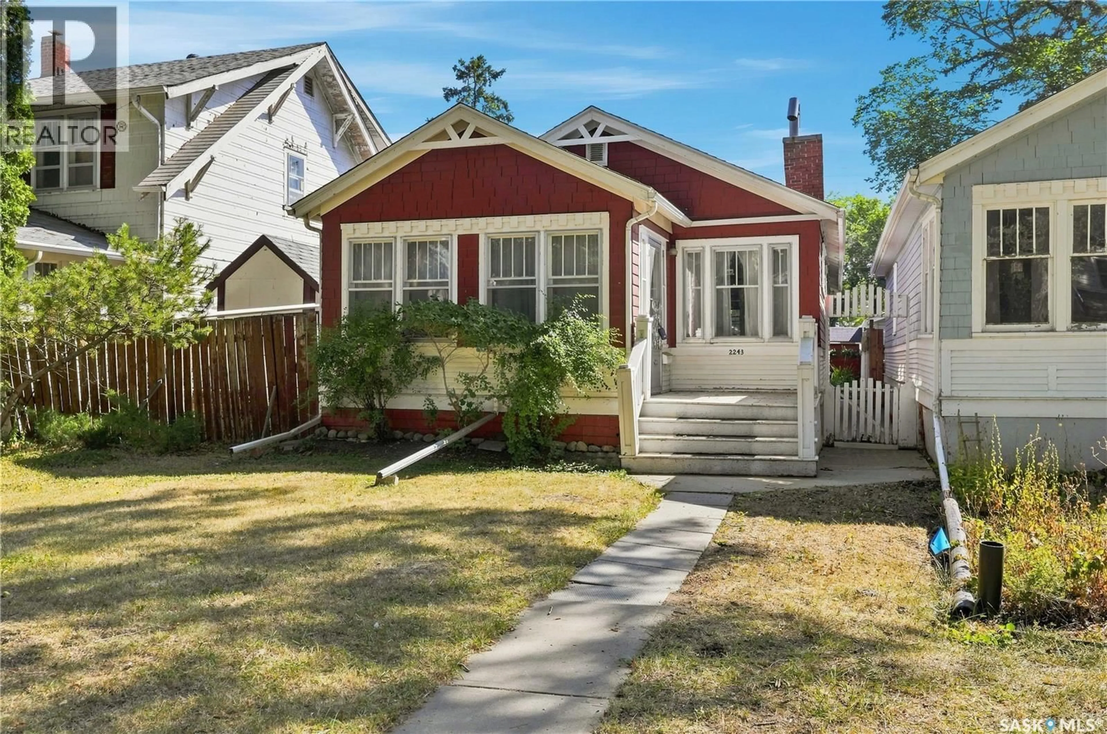 Home with vinyl exterior material, street for 2243 MONTREAL STREET, Regina Saskatchewan S4P1L7