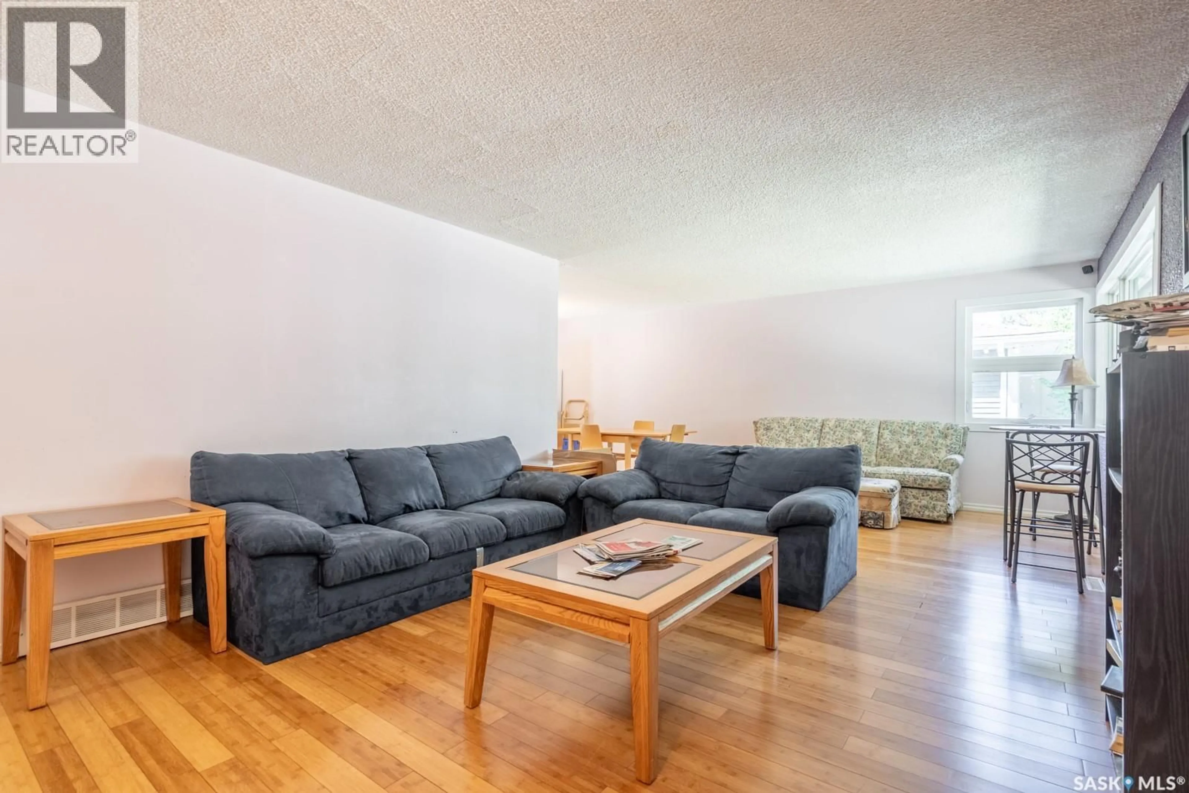 Living room with furniture, wood/laminate floor for 60 DUNNING CRESCENT, Regina Saskatchewan S4S3W1
