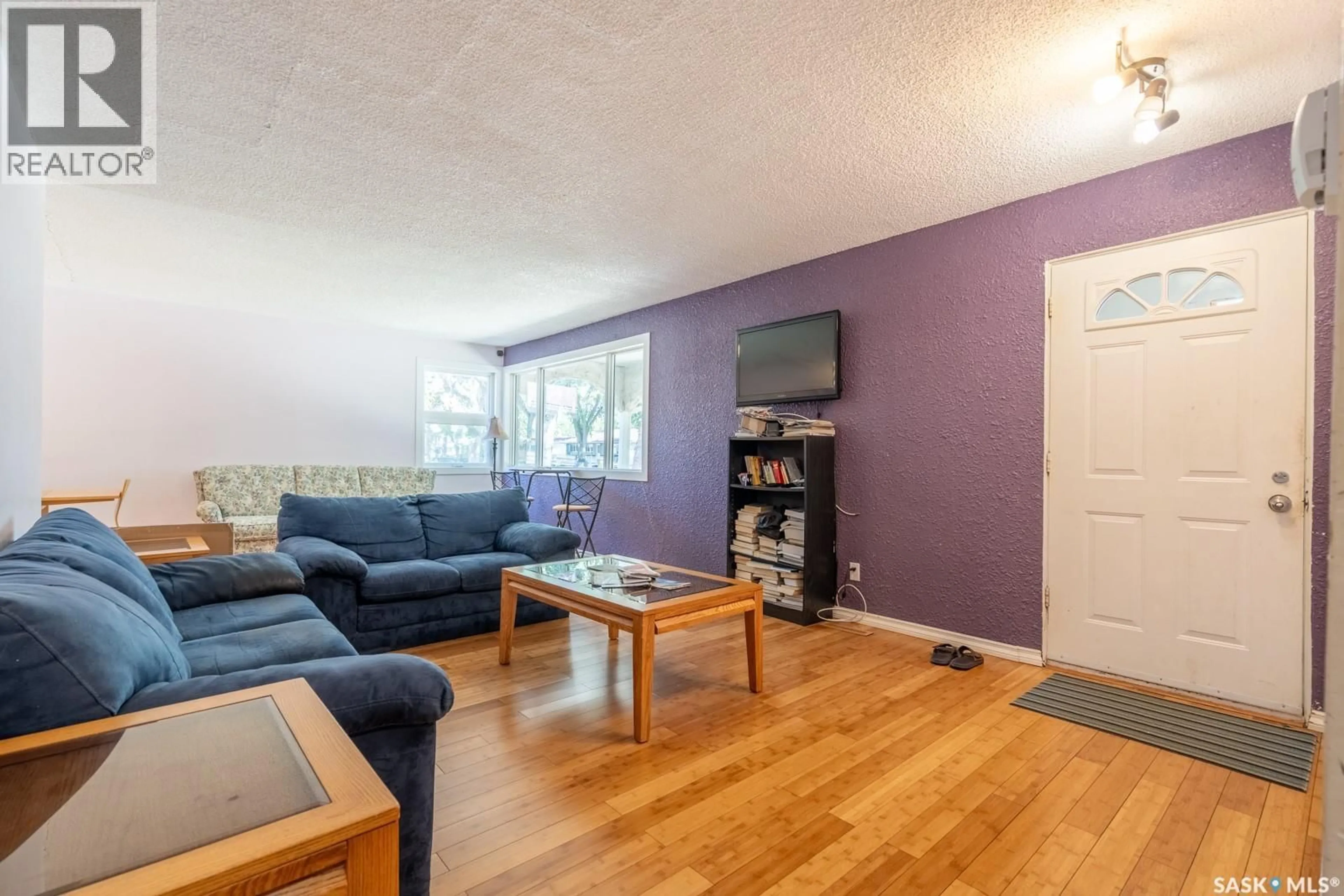 Living room with furniture, wood/laminate floor for 60 DUNNING CRESCENT, Regina Saskatchewan S4S3W1