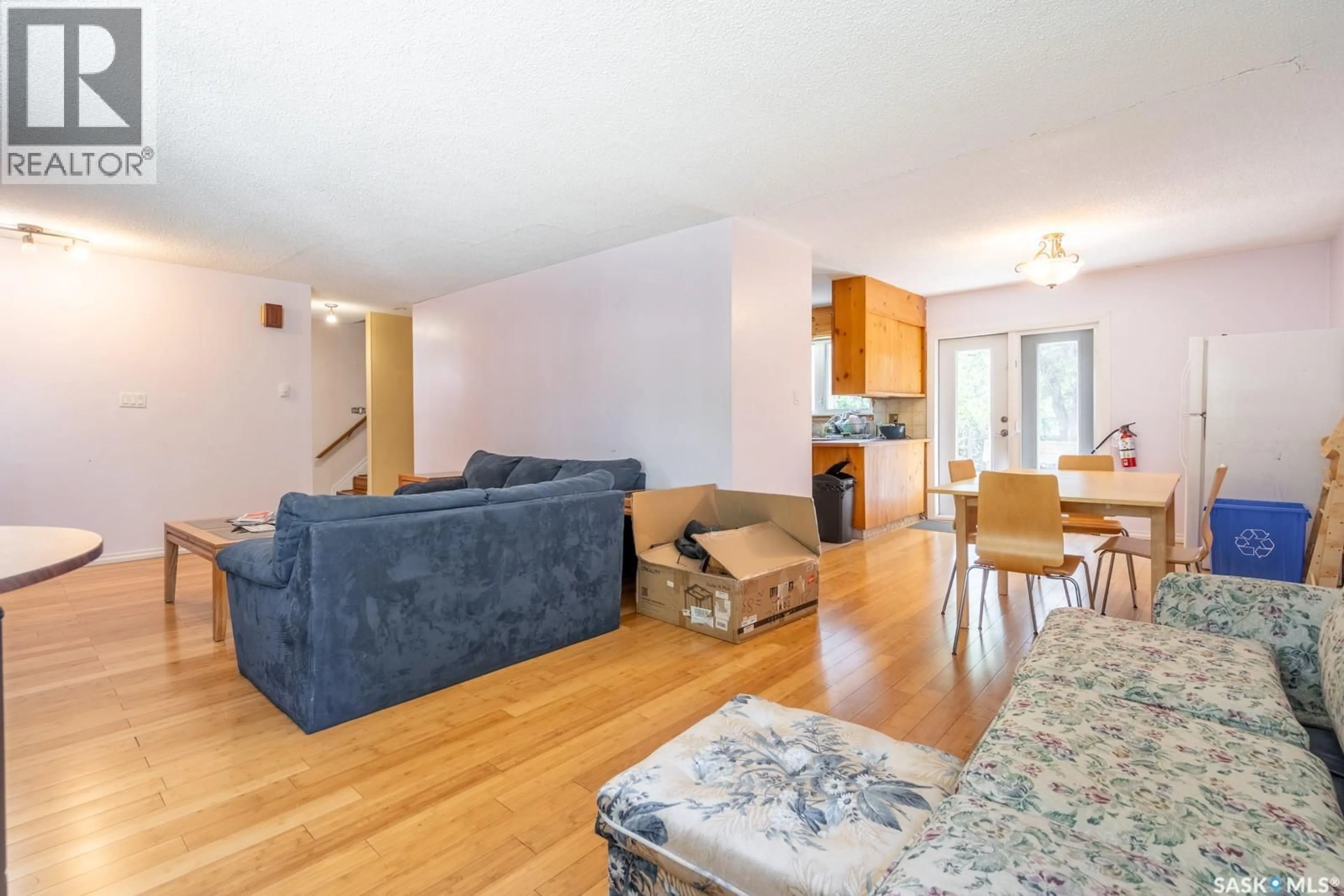 Living room with furniture, wood/laminate floor for 60 DUNNING CRESCENT, Regina Saskatchewan S4S3W1