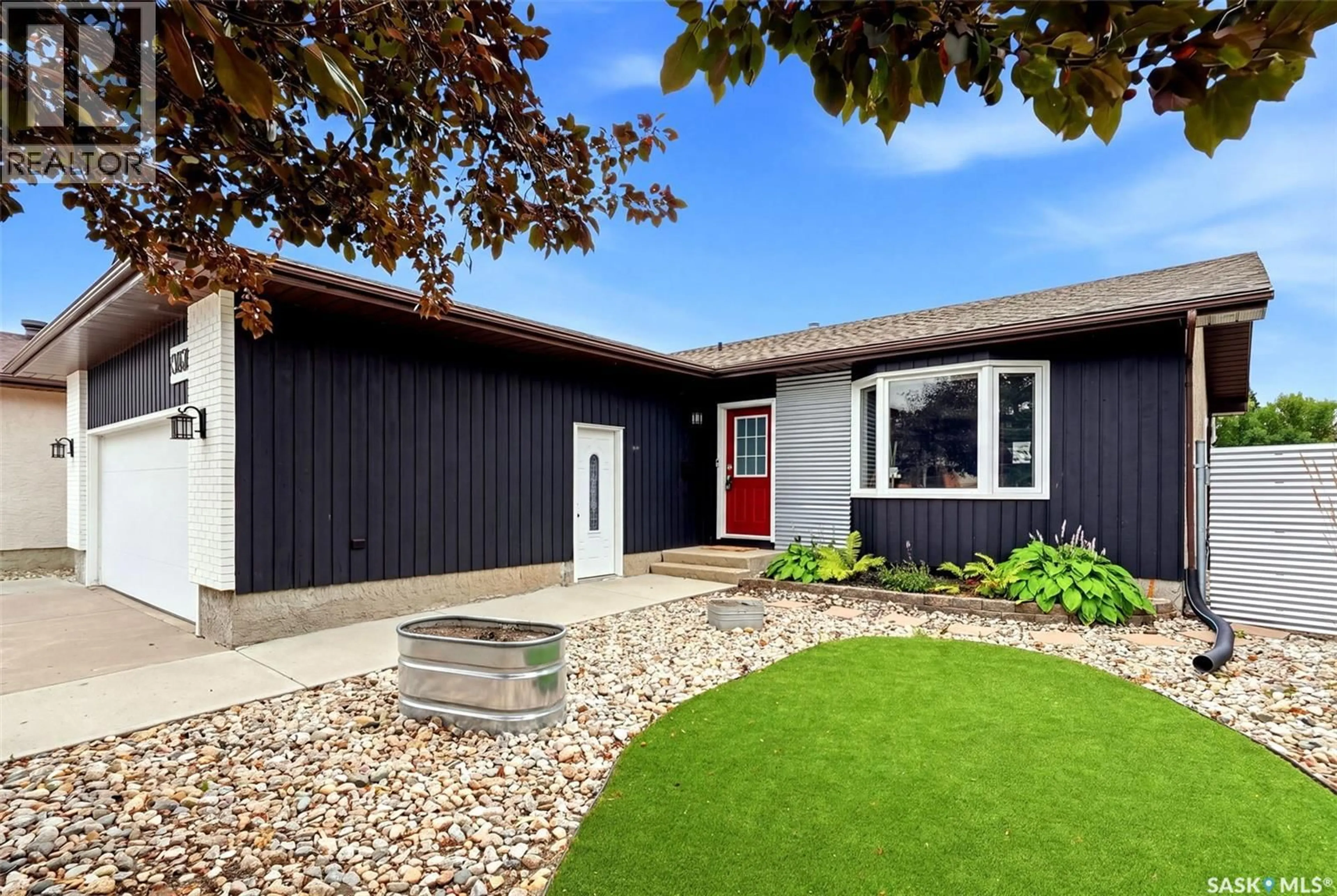 Home with vinyl exterior material, street for 7310 CRIBBS BAY, Regina Saskatchewan S4X4H3