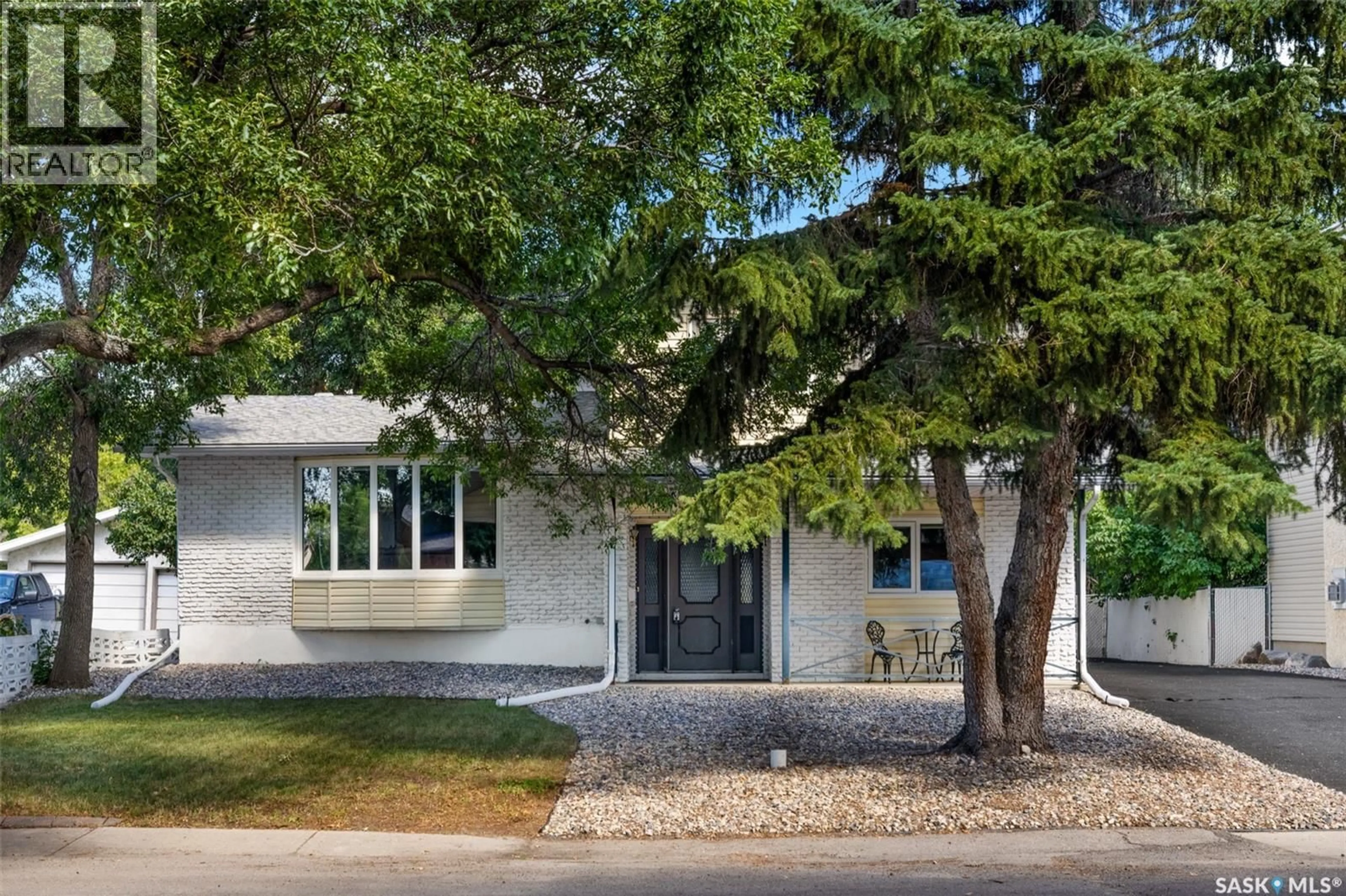 Home with brick exterior material, street for 305 HANLEY CRESCENT, Regina Saskatchewan S4R5A9