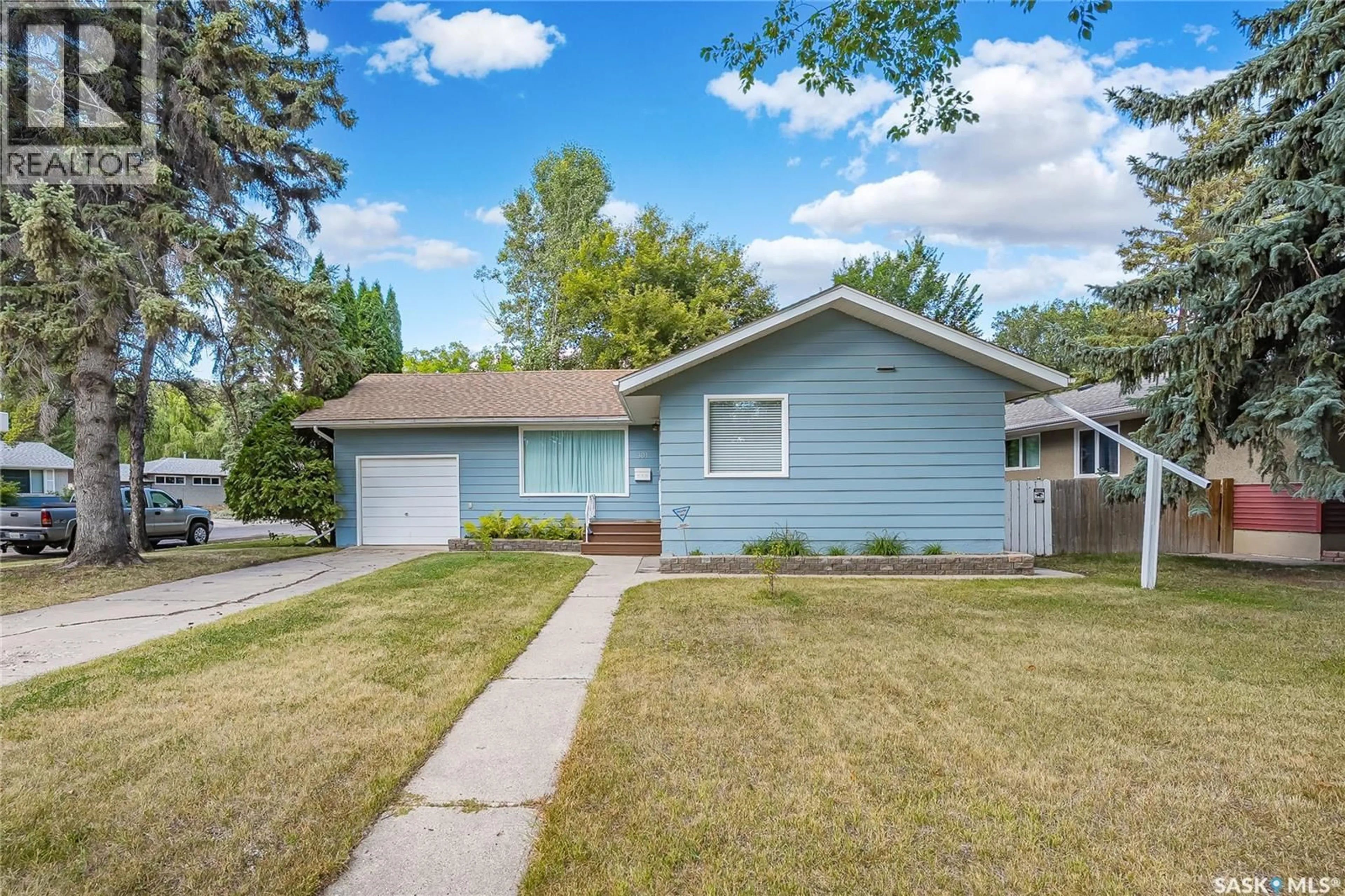 Home with vinyl exterior material, street for 301 CASCADE STREET, Saskatoon Saskatchewan S7J0M4