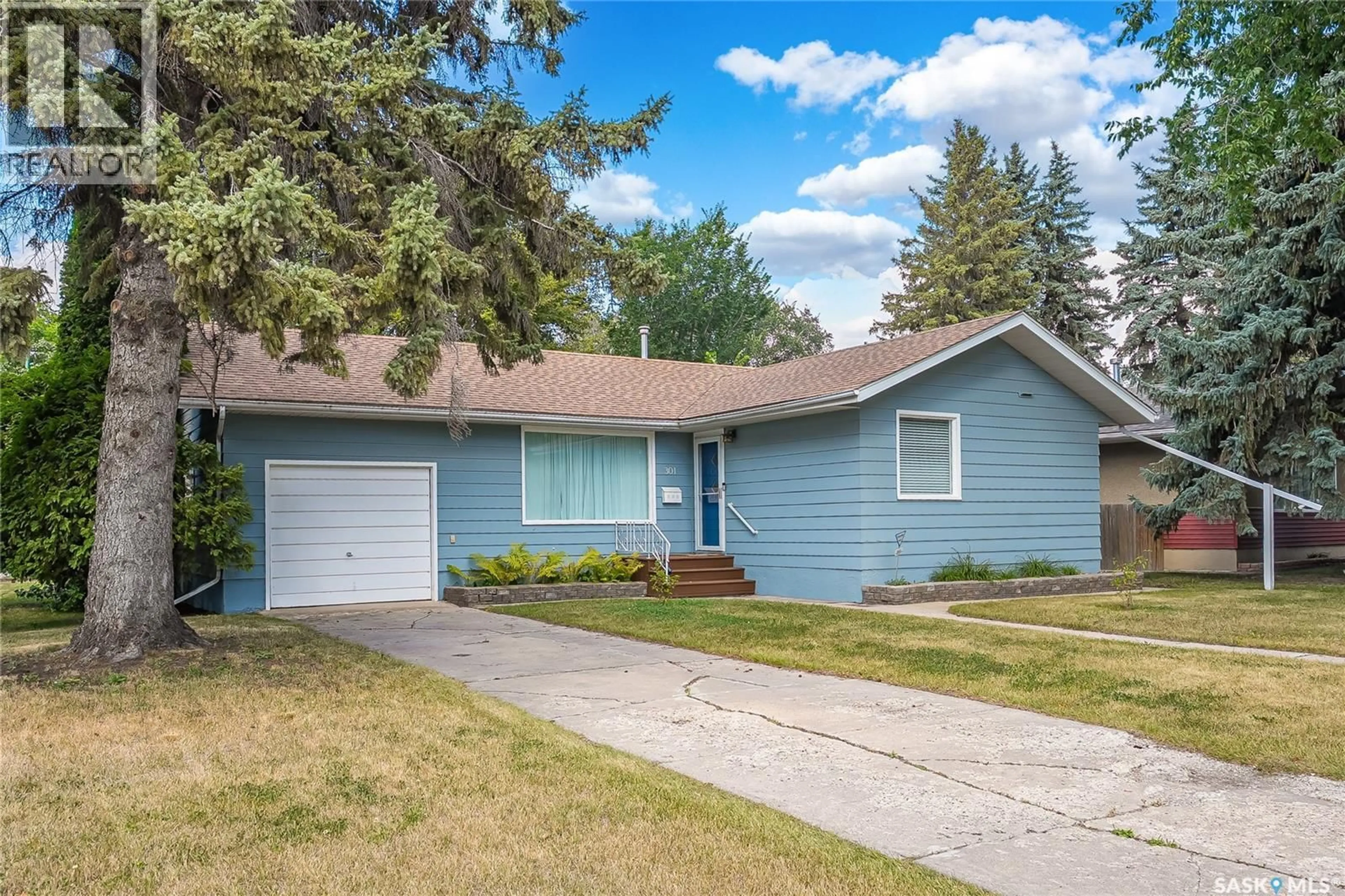 Home with vinyl exterior material, street for 301 CASCADE STREET, Saskatoon Saskatchewan S7J0M4