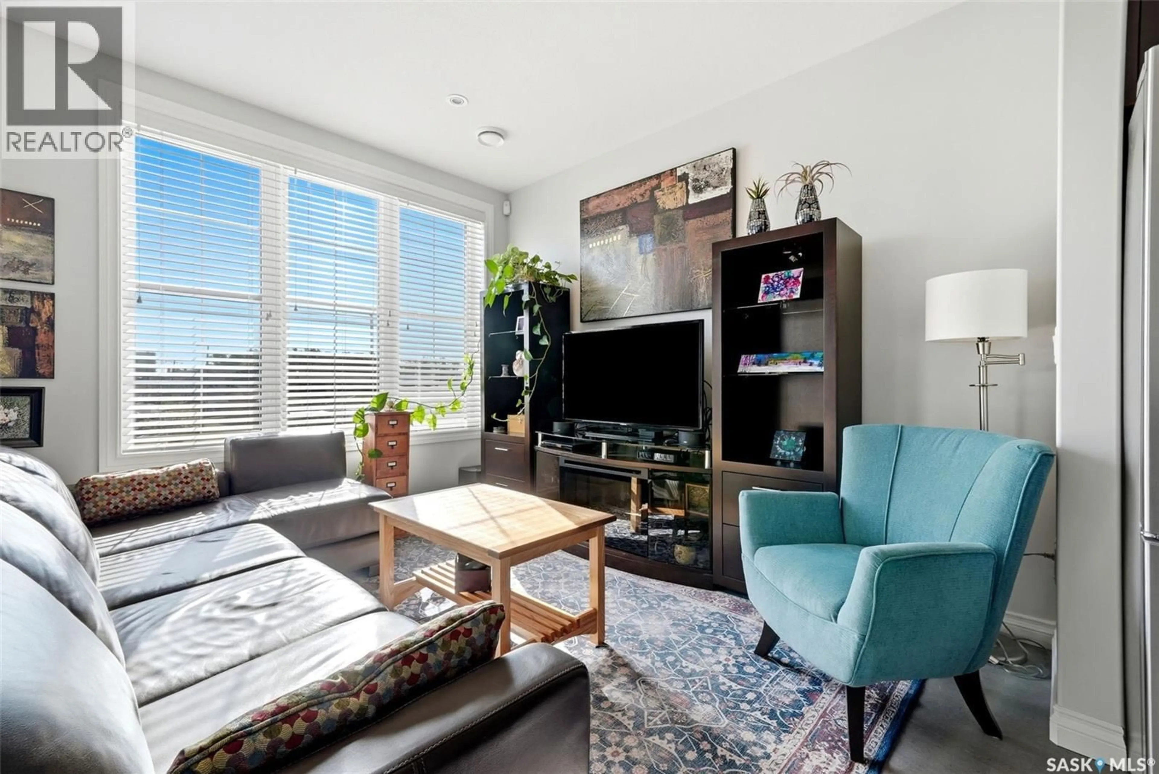 Living room with furniture, unknown for 206 - 1715 BADHAM BOULEVARD, Regina Saskatchewan S4P0L9