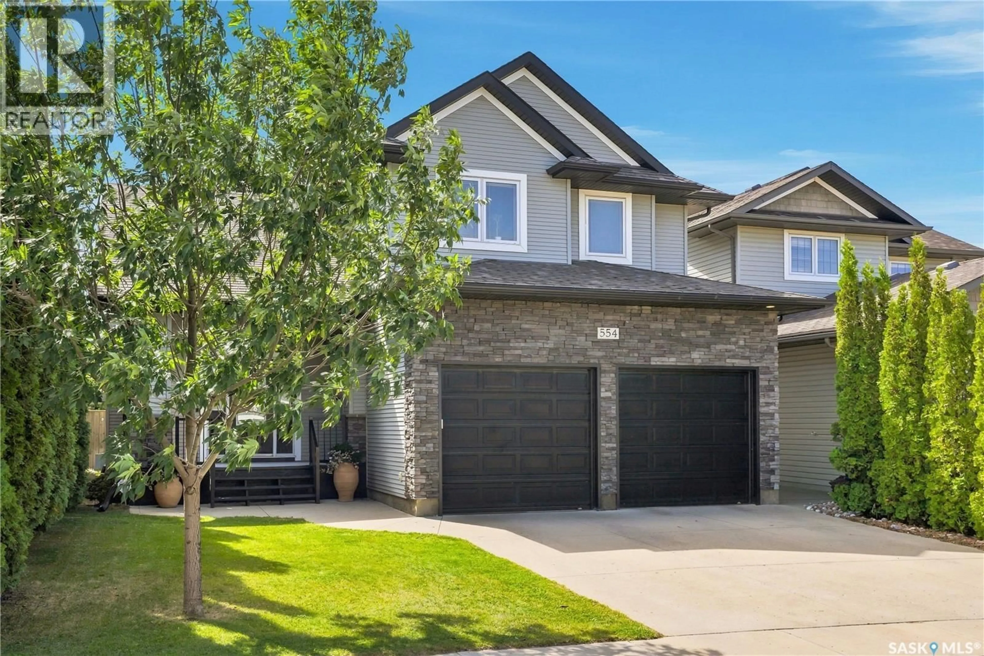 Home with brick exterior material, street for 554 LYND PLACE, Saskatoon Saskatchewan S7T0C6