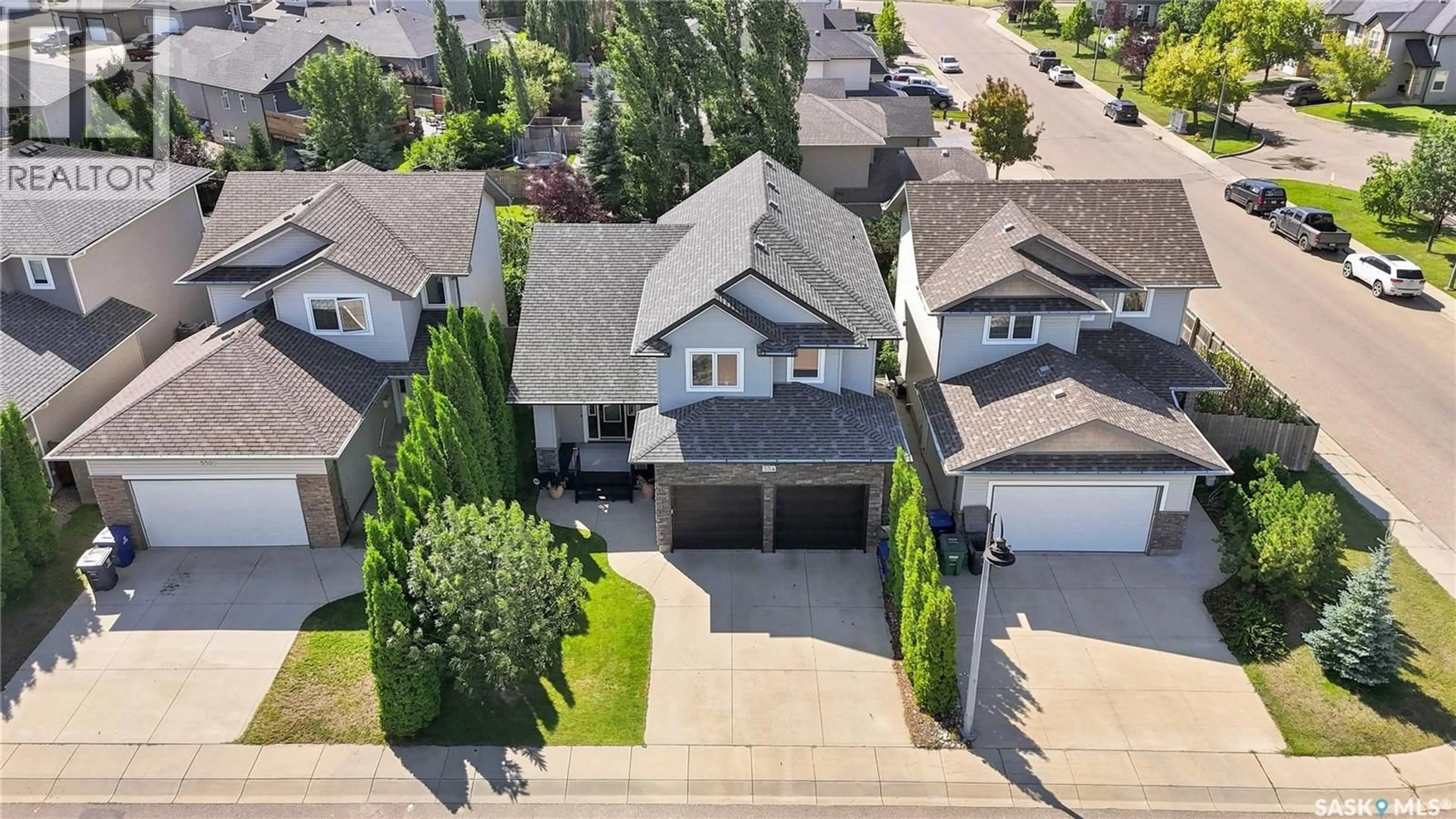 A pic from outside/outdoor area/front of a property/back of a property/a pic from drone, street for 554 LYND PLACE, Saskatoon Saskatchewan S7T0C6