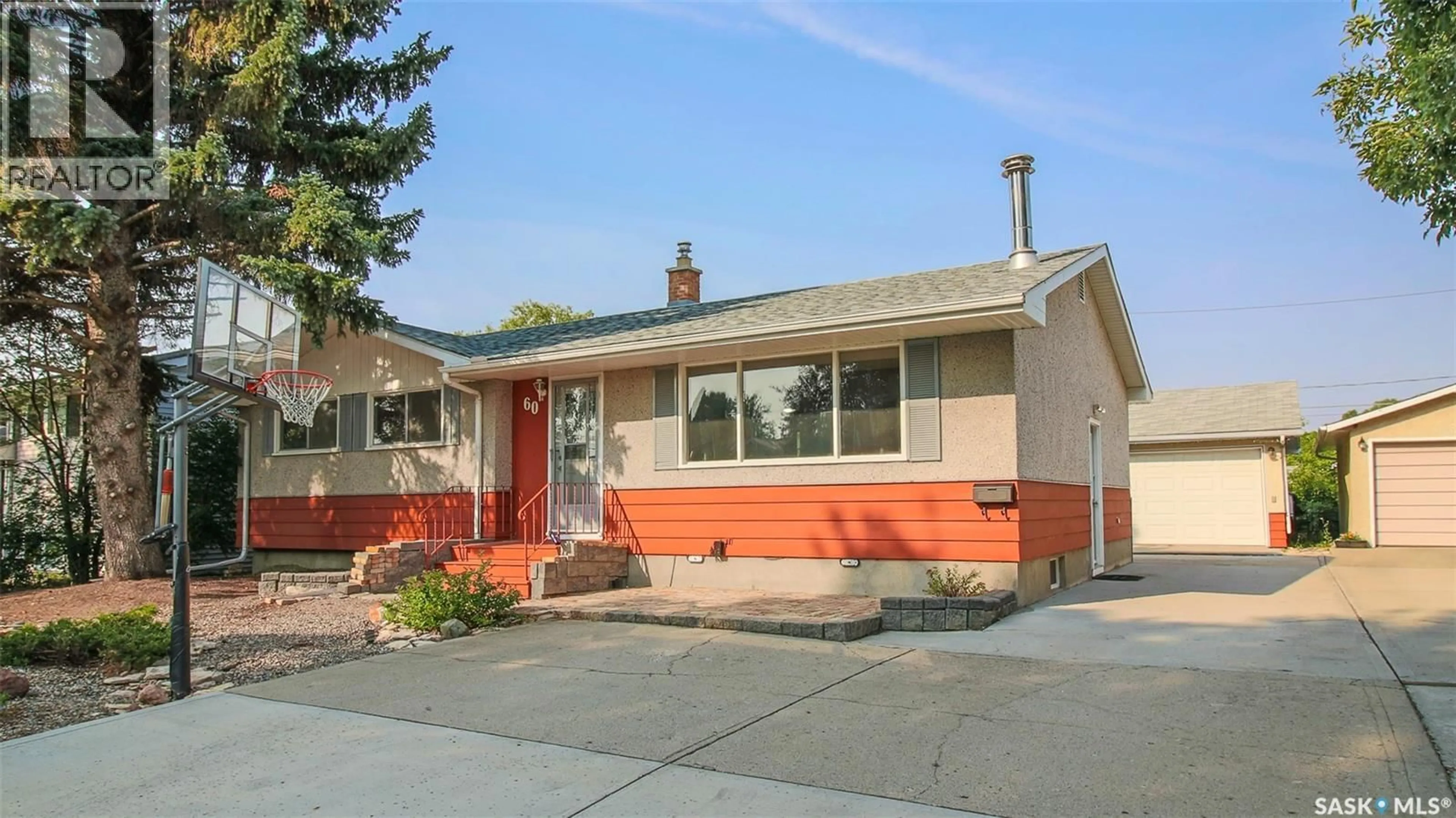 Home with vinyl exterior material, street for 60 GALE STREET, Regina Saskatchewan S4R4E1