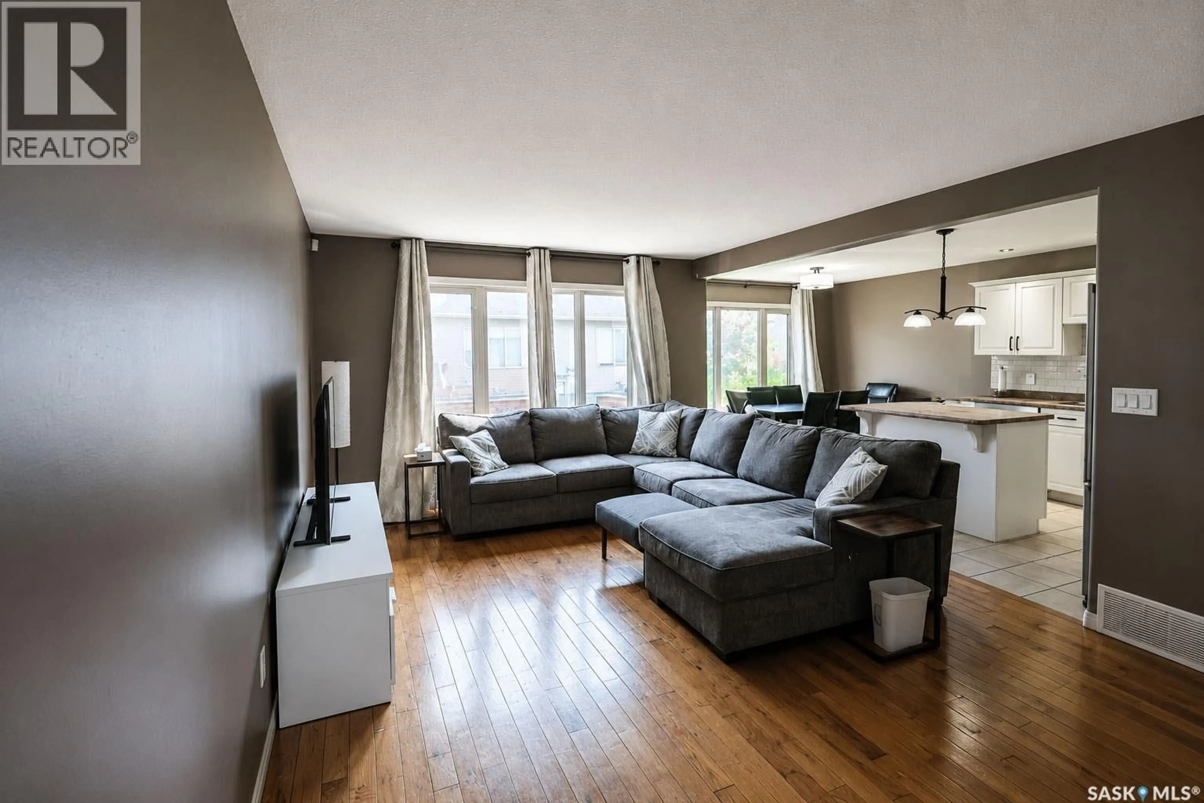 Living room with furniture, wood/laminate floor for 53 1600 MUZZY DRIVE, Prince Albert Saskatchewan S6X0A1