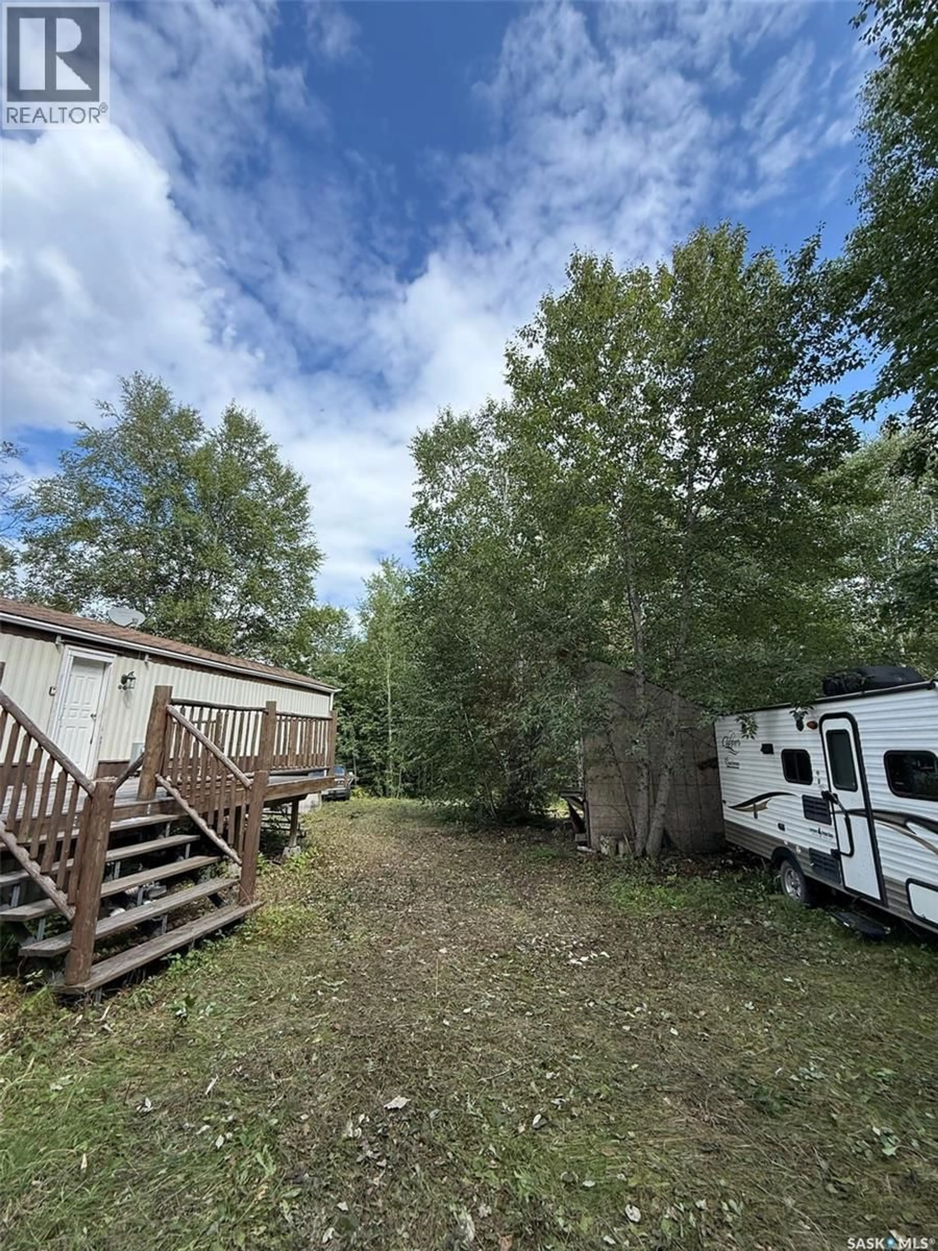 A pic from outside/outdoor area/front of a property/back of a property/a pic from drone, forest/trees view for 1103 ATEGAMEG BAY, Northern Admin District Saskatchewan S0J1L0