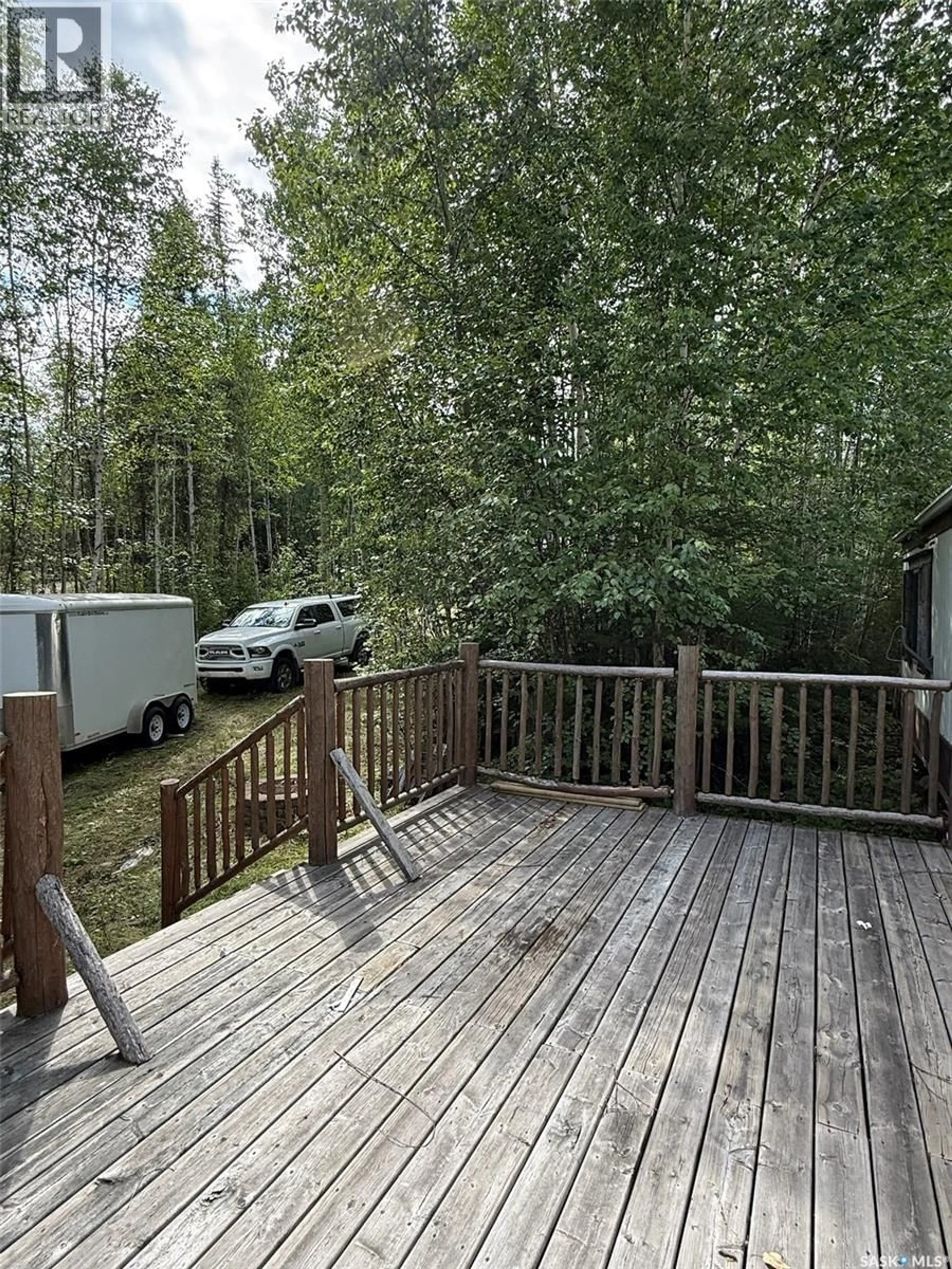 Patio, forest/trees view for 1103 ATEGAMEG BAY, Northern Admin District Saskatchewan S0J1L0