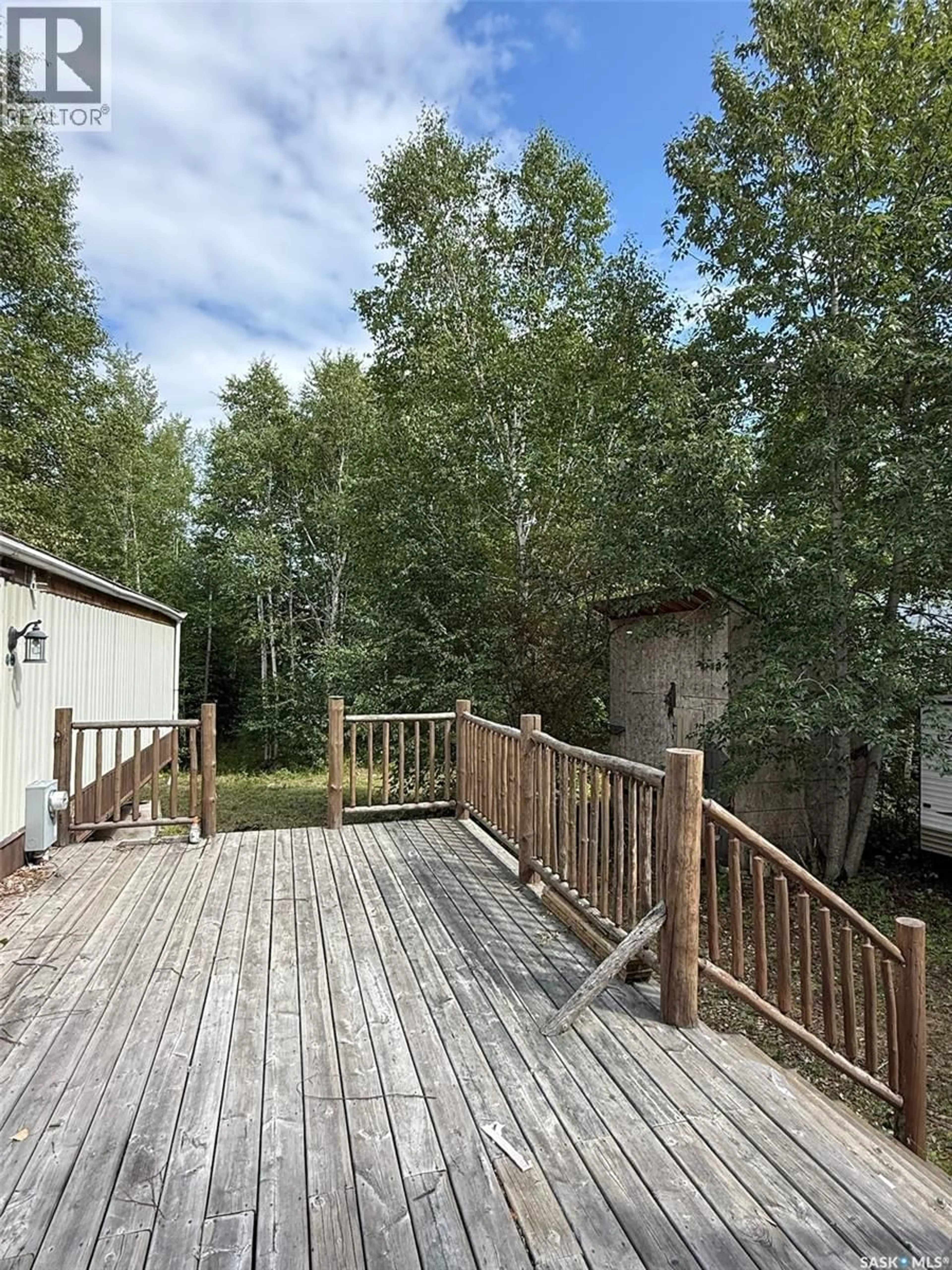Patio, forest/trees view for 1103 ATEGAMEG BAY, Northern Admin District Saskatchewan S0J1L0