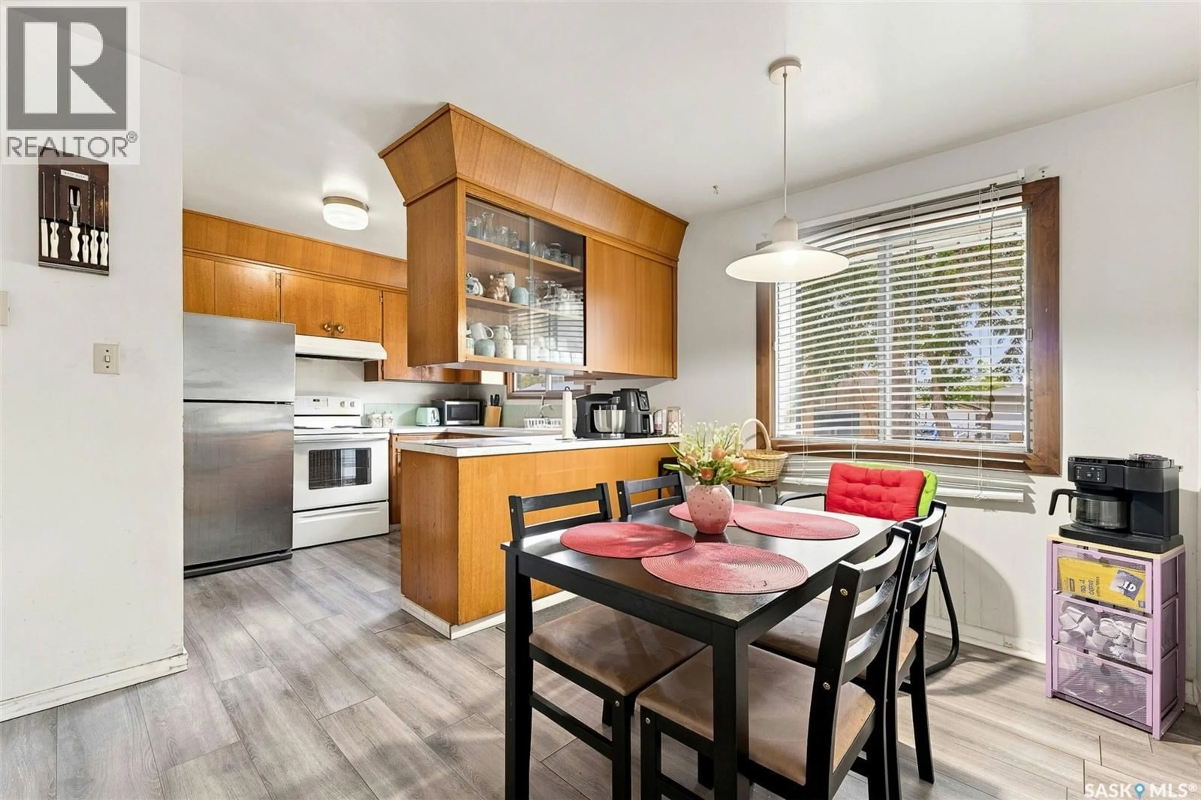 Open concept kitchen, wood/laminate floor for 75 CANNON STREET, Regina Saskatchewan S4N1L9