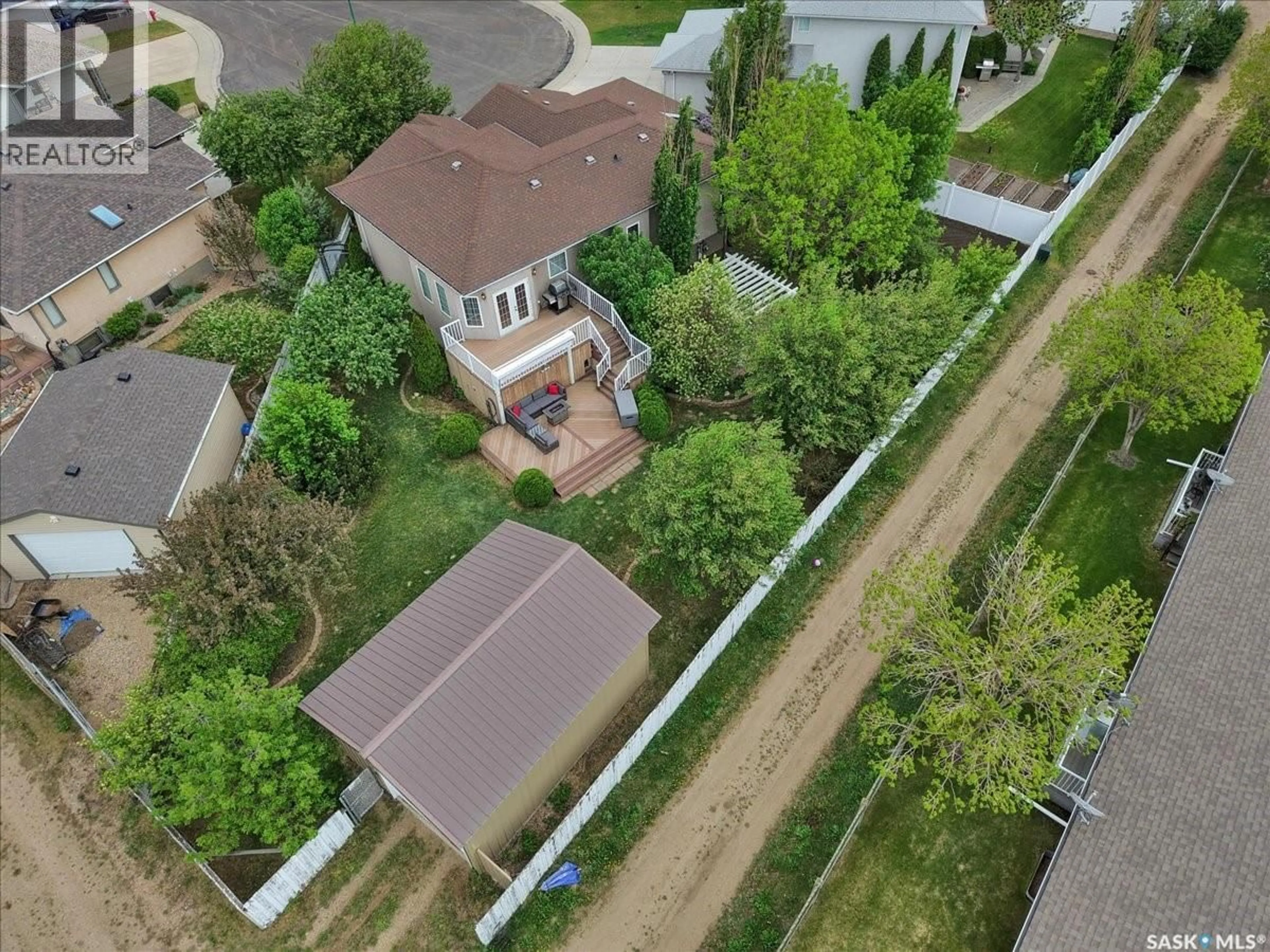 A pic from outside/outdoor area/front of a property/back of a property/a pic from drone, street for 214 BURKE PLACE, Warman Saskatchewan S0K4S0