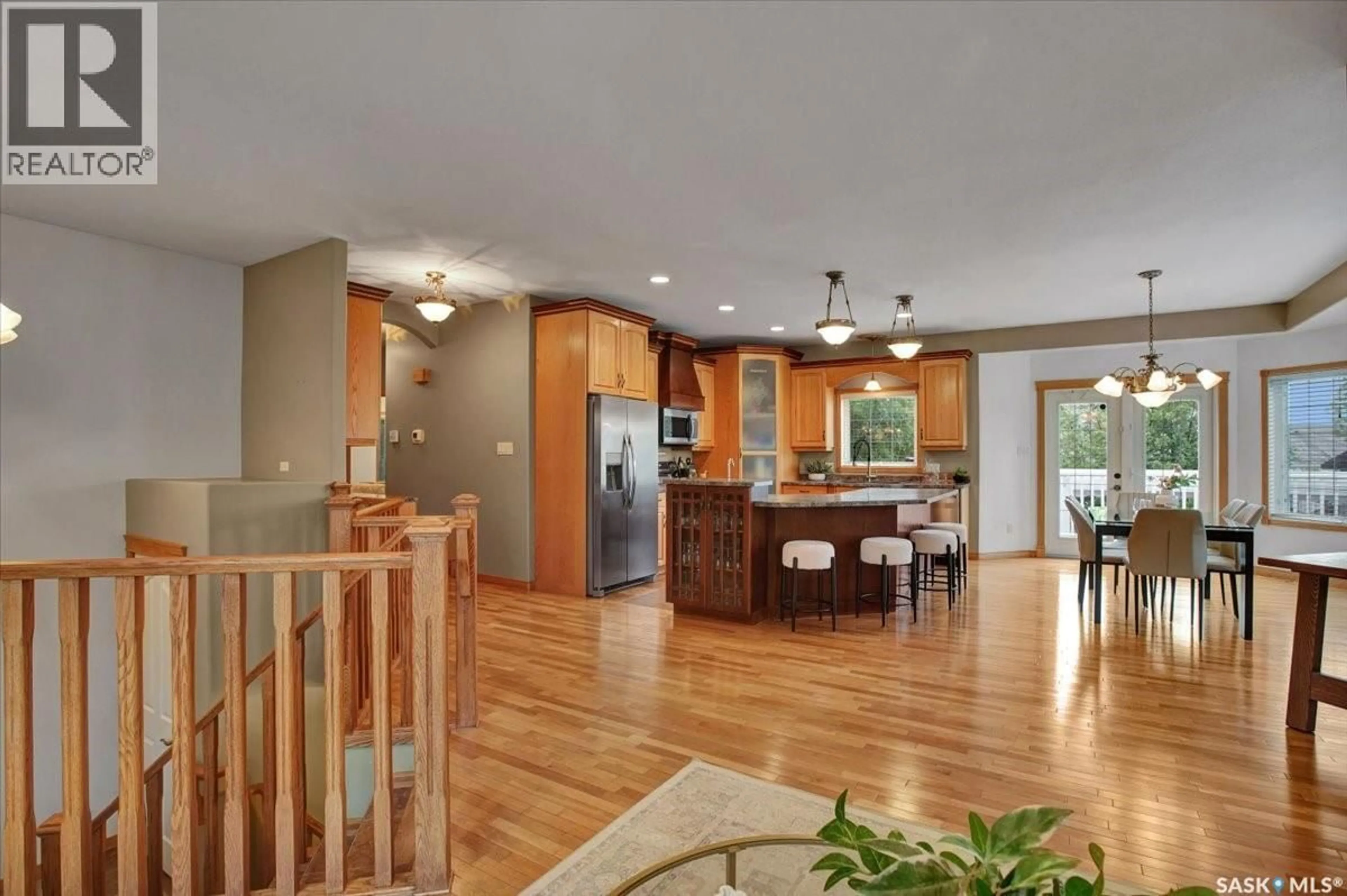 Open concept kitchen, wood/laminate floor for 214 BURKE PLACE, Warman Saskatchewan S0K4S0