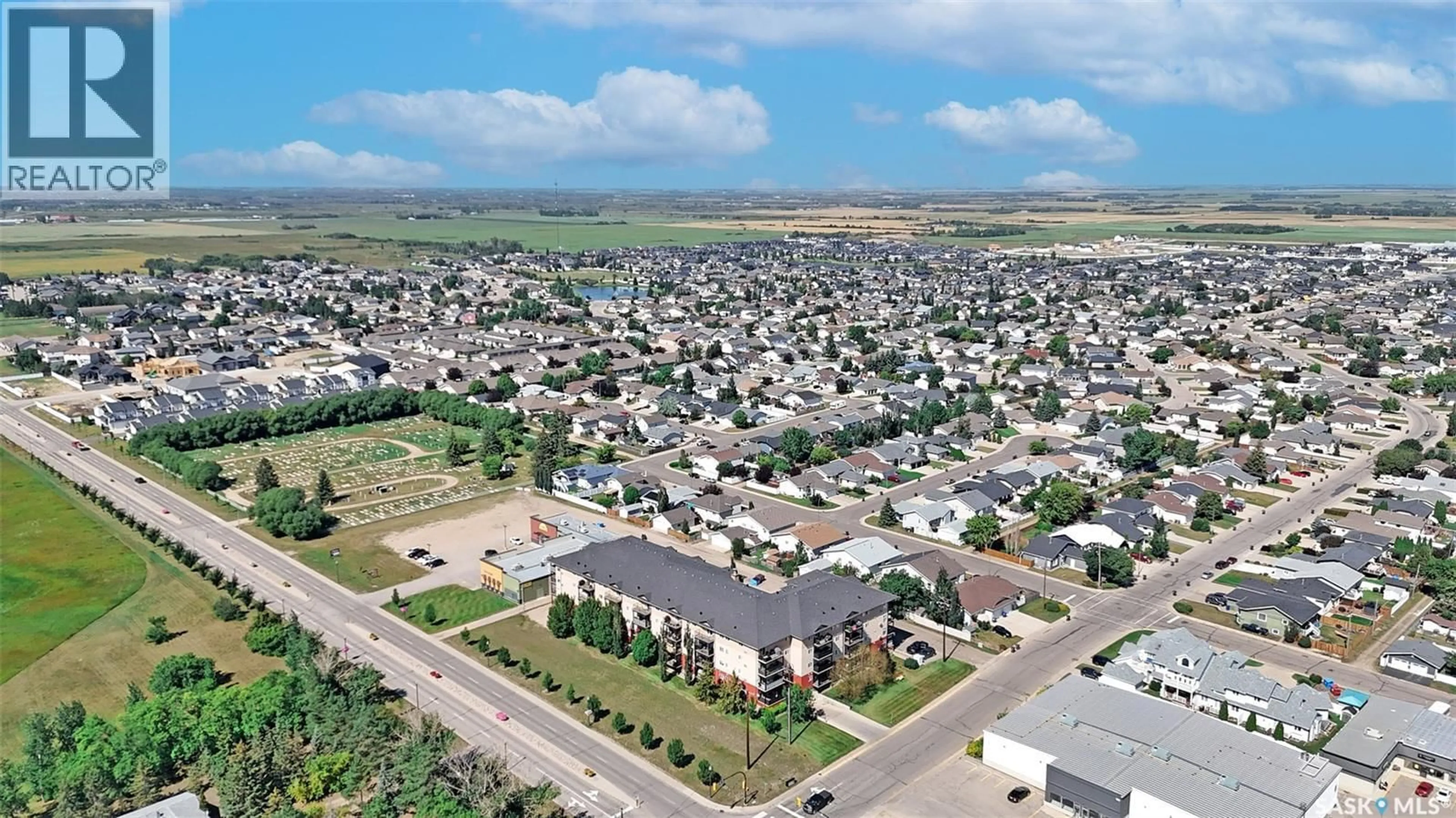 A pic from outside/outdoor area/front of a property/back of a property/a pic from drone, street for N - 409 100 1ST AVENUE, Warman Saskatchewan S0K4S1