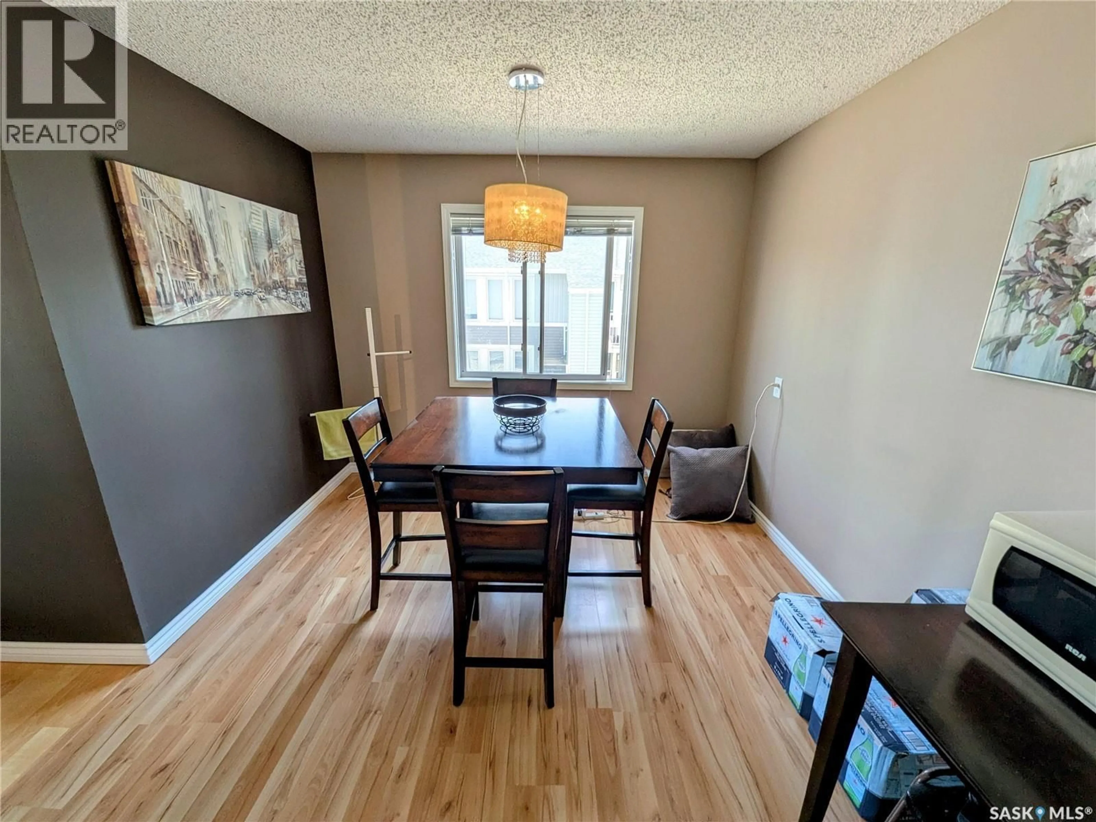 Dining room, wood/laminate floor for 7307 DALGLIESH DRIVE, Regina Saskatchewan S4X2B8