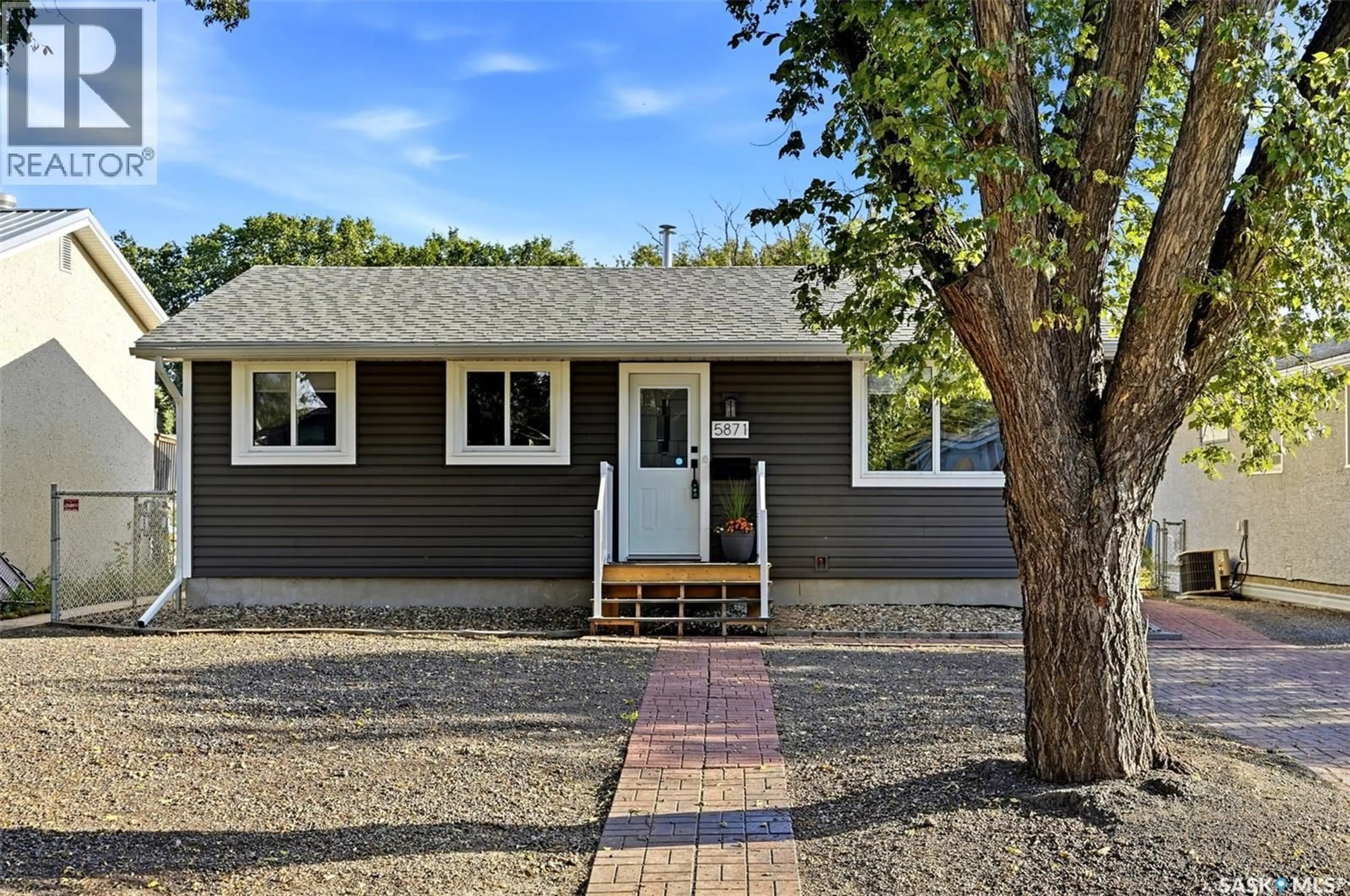 Home with vinyl exterior material, street for 5871 MCKINLEY AVENUE, Regina Saskatchewan S4T6P4